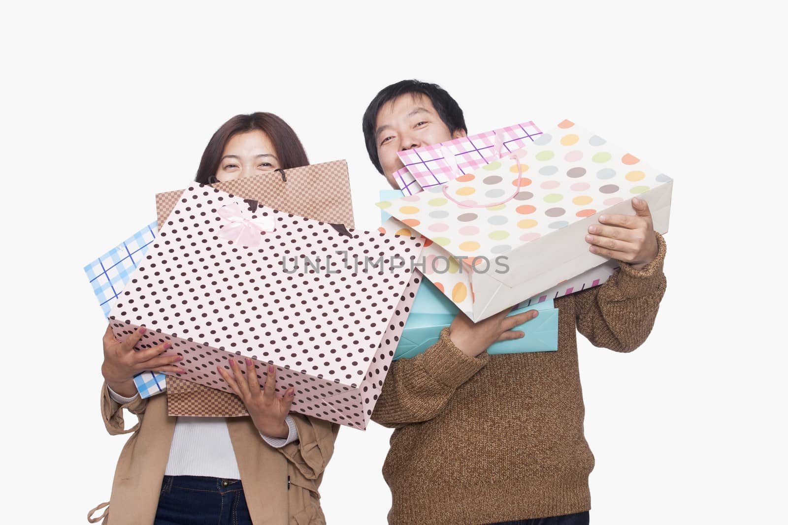 Couple carrying shopping bags by XiXinXing