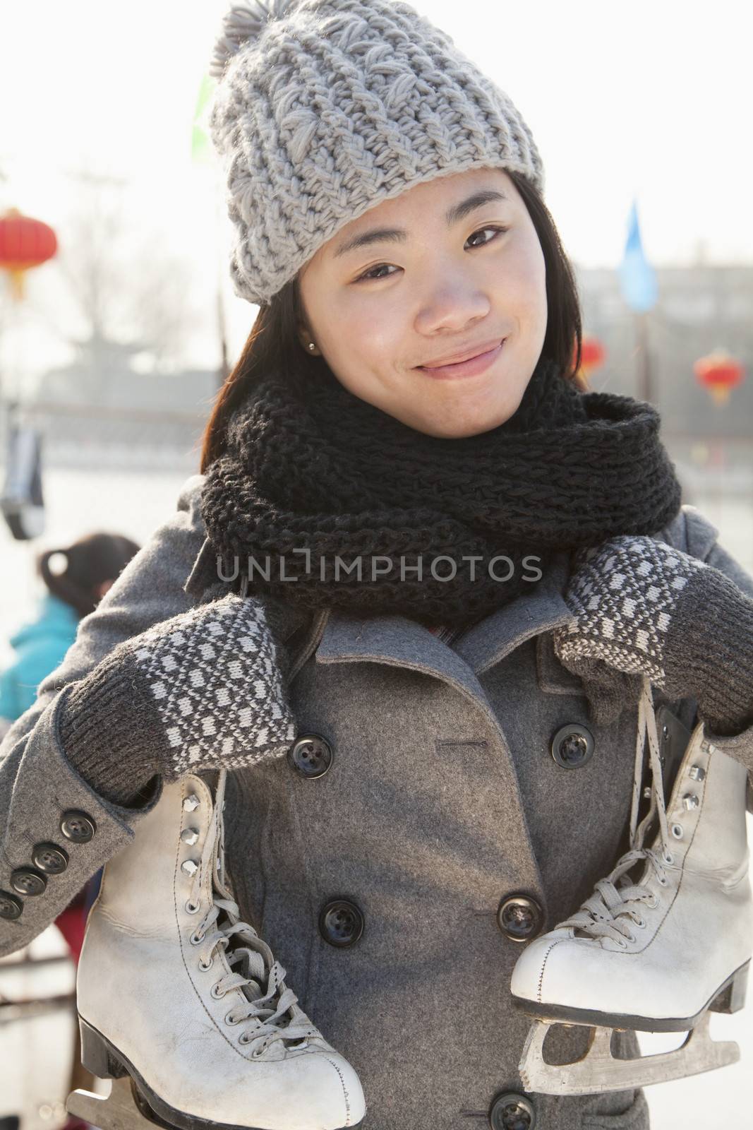 Young woman ice skating portrait, Beijing