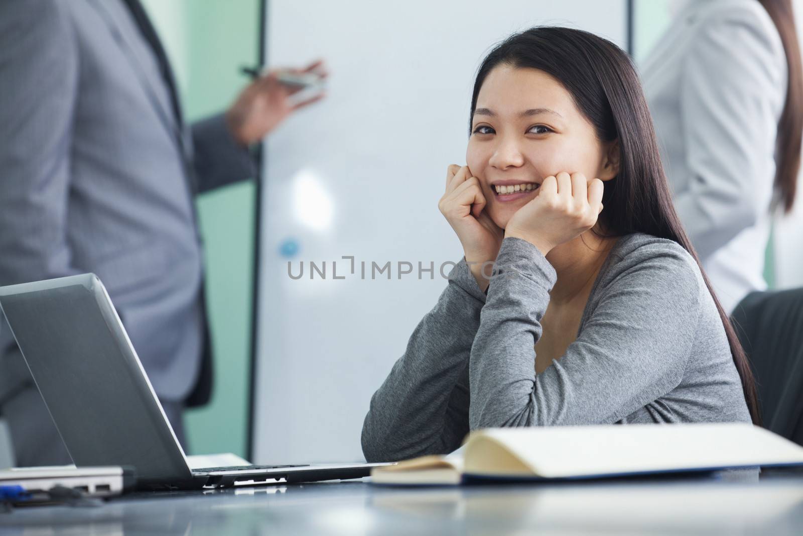 Young Businesswoman Looking at Camera  by XiXinXing