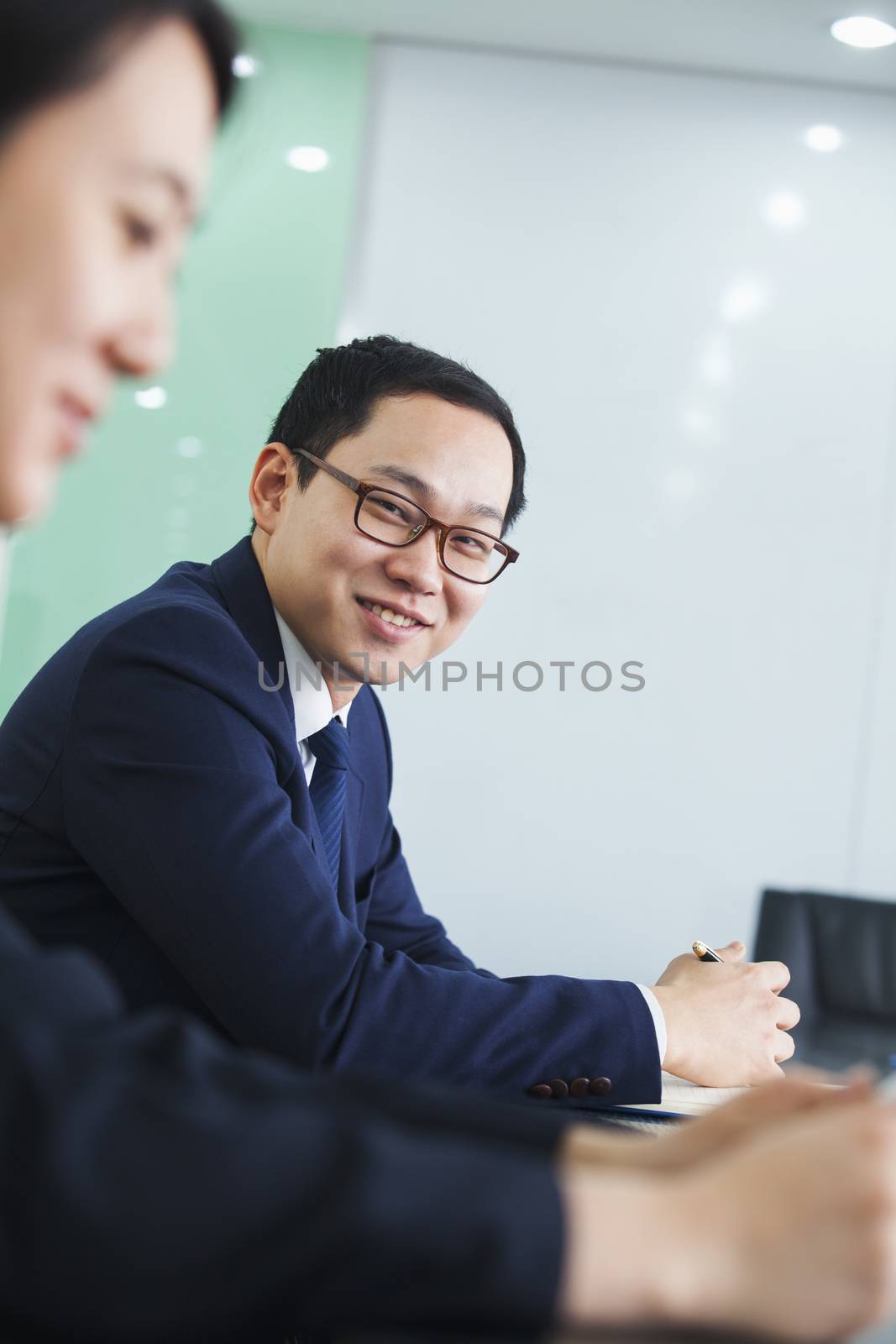 Portrait of Businessman in a Conference Room