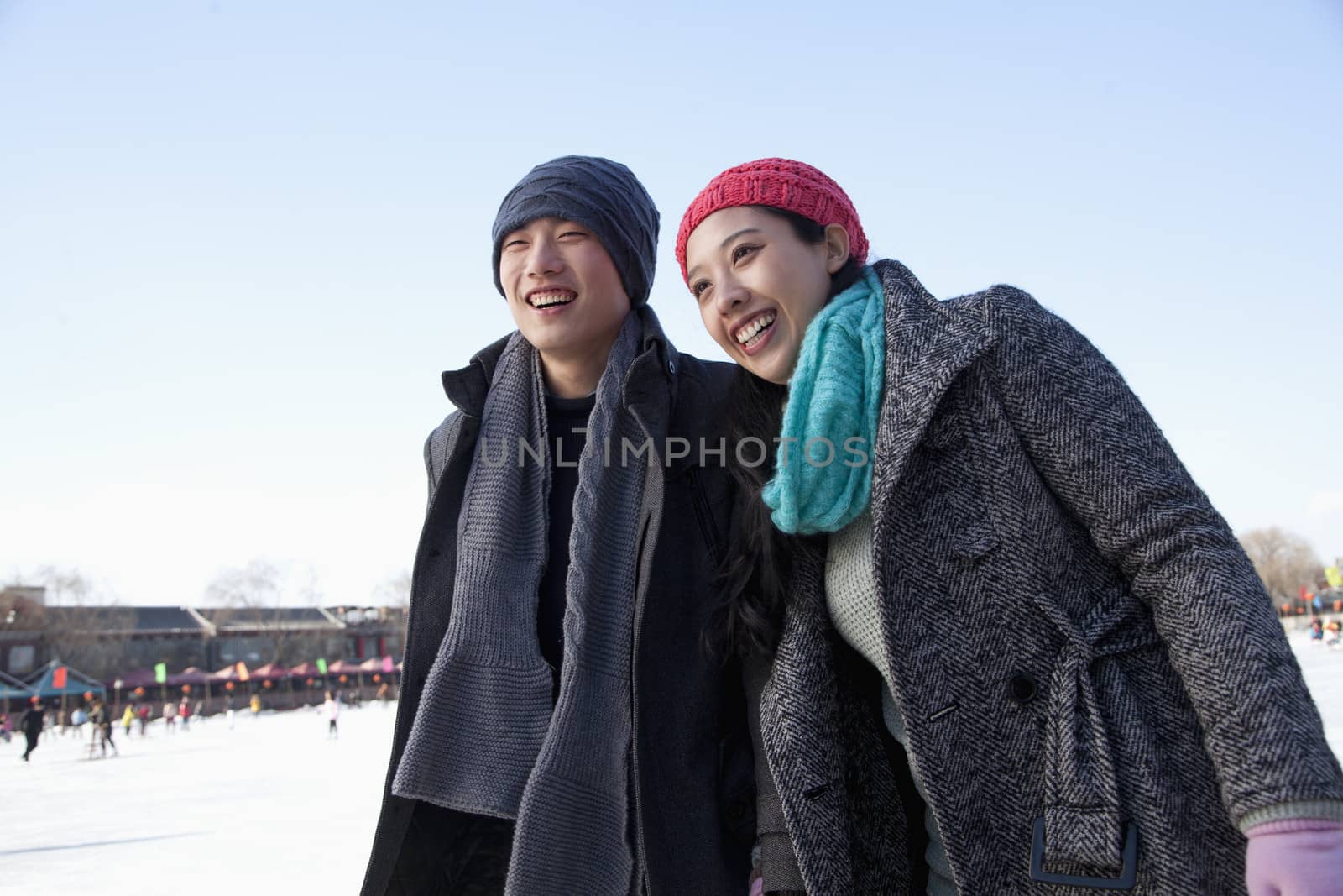 Young couple at ice rink by XiXinXing