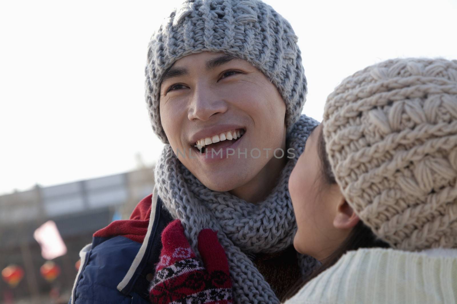 Young couple skating at ice rink