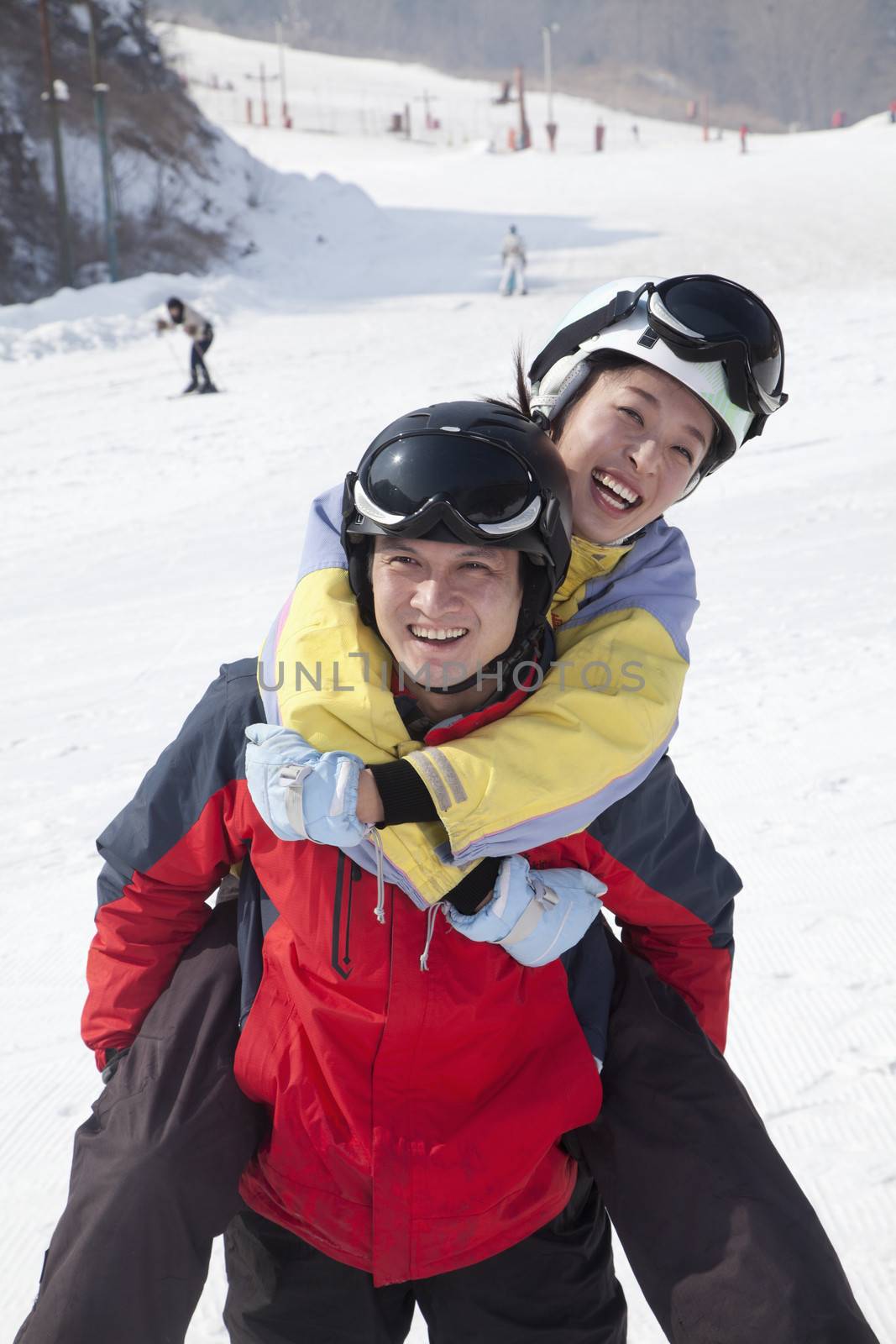 Smiling Couple in Ski Resort