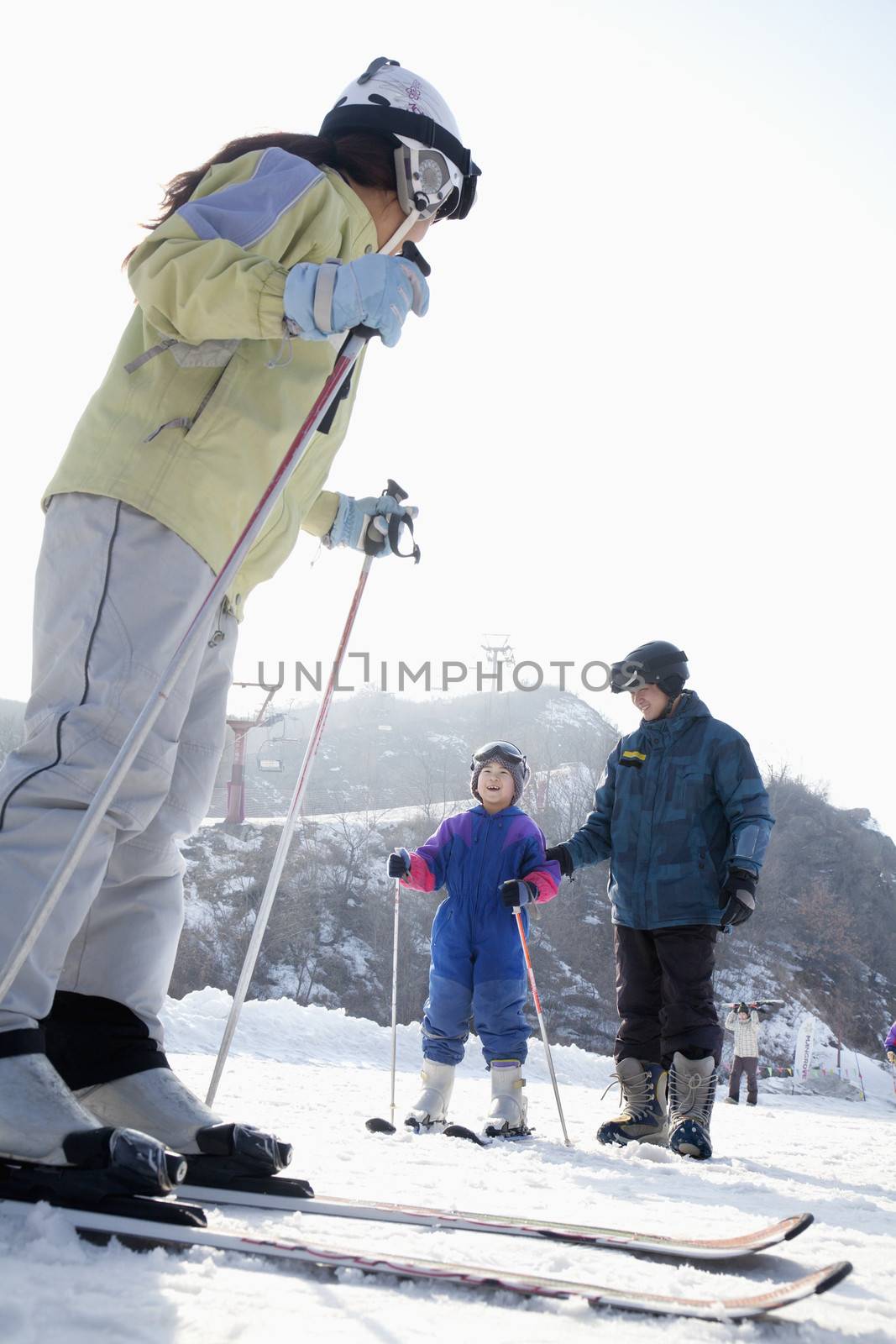 Family Skiing in Ski Resort by XiXinXing