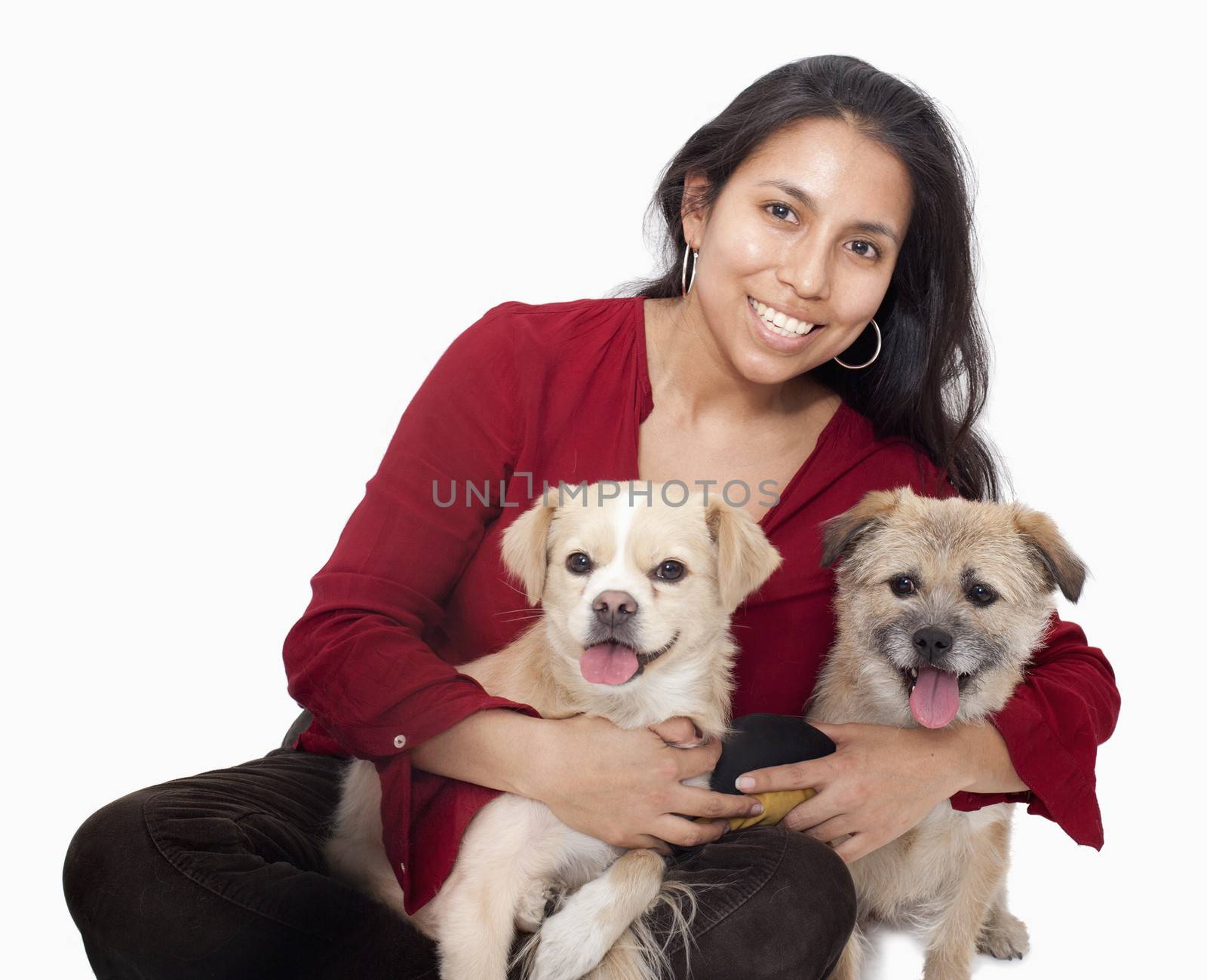 Portrait of woman embracing her dogs, studio shot by XiXinXing