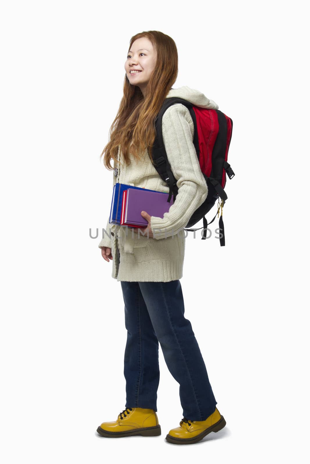 Smiling female student walking