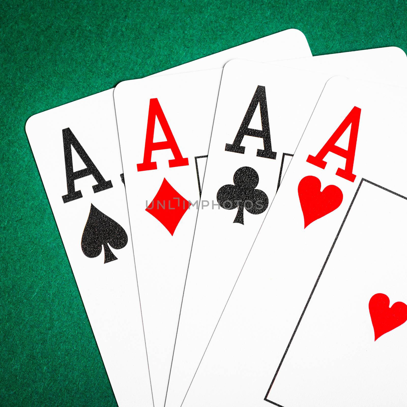 Four aces on a green table casino