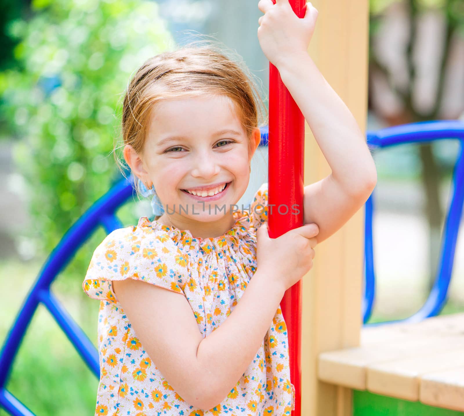 smiling little girl on the playground