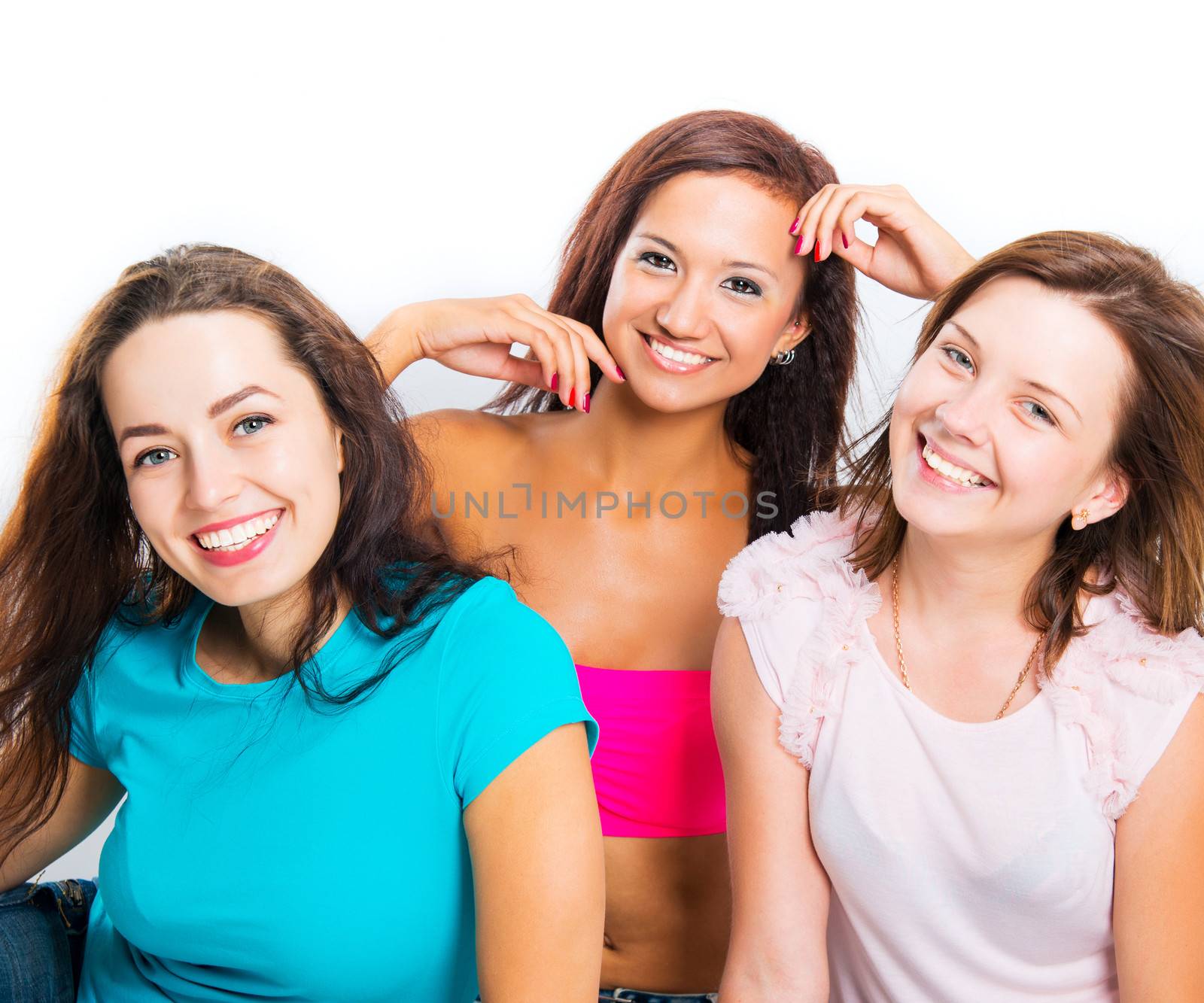 three beautiful teenage girls smiling on white background