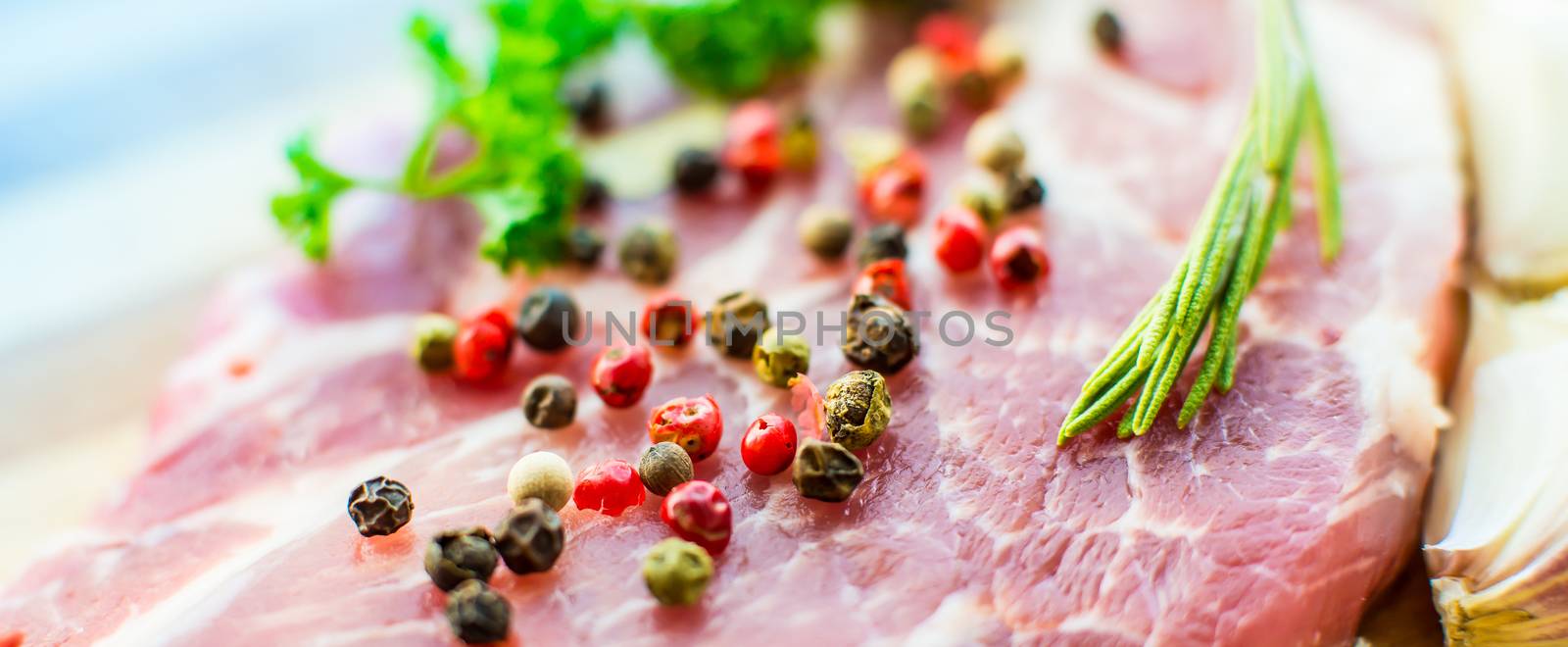 raw meat for steak with rosemary and herbs