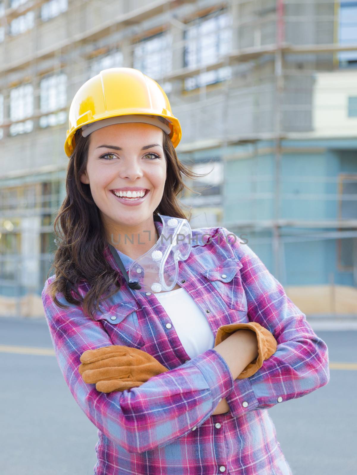 Young Attractive Female Construction Worker Wearing Hard Hat and by Feverpitched