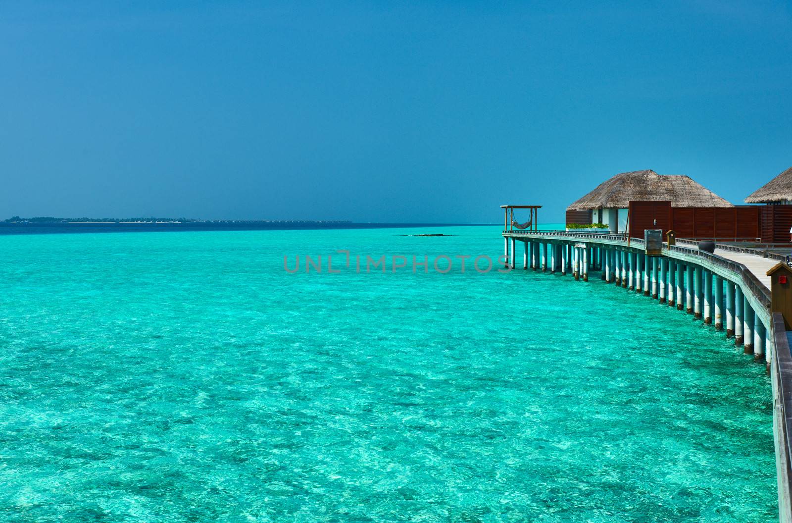 Beautiful beach with water bungalows at Maldives