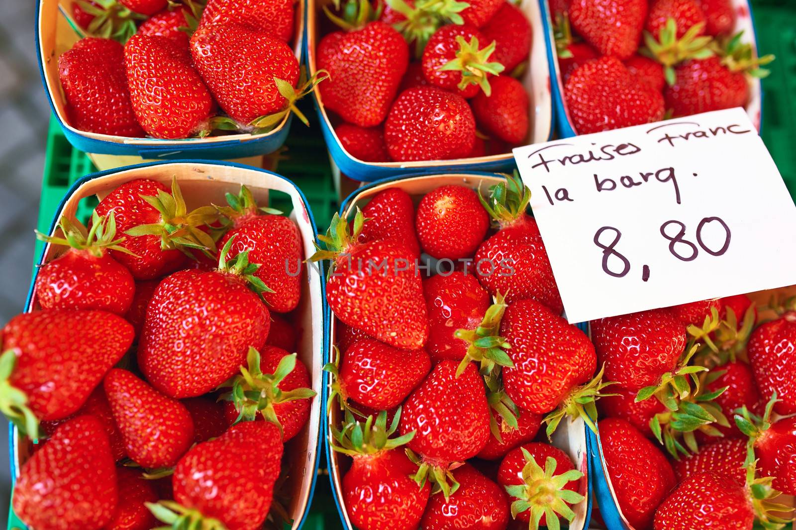 Baskets of fresh strawberries at street market