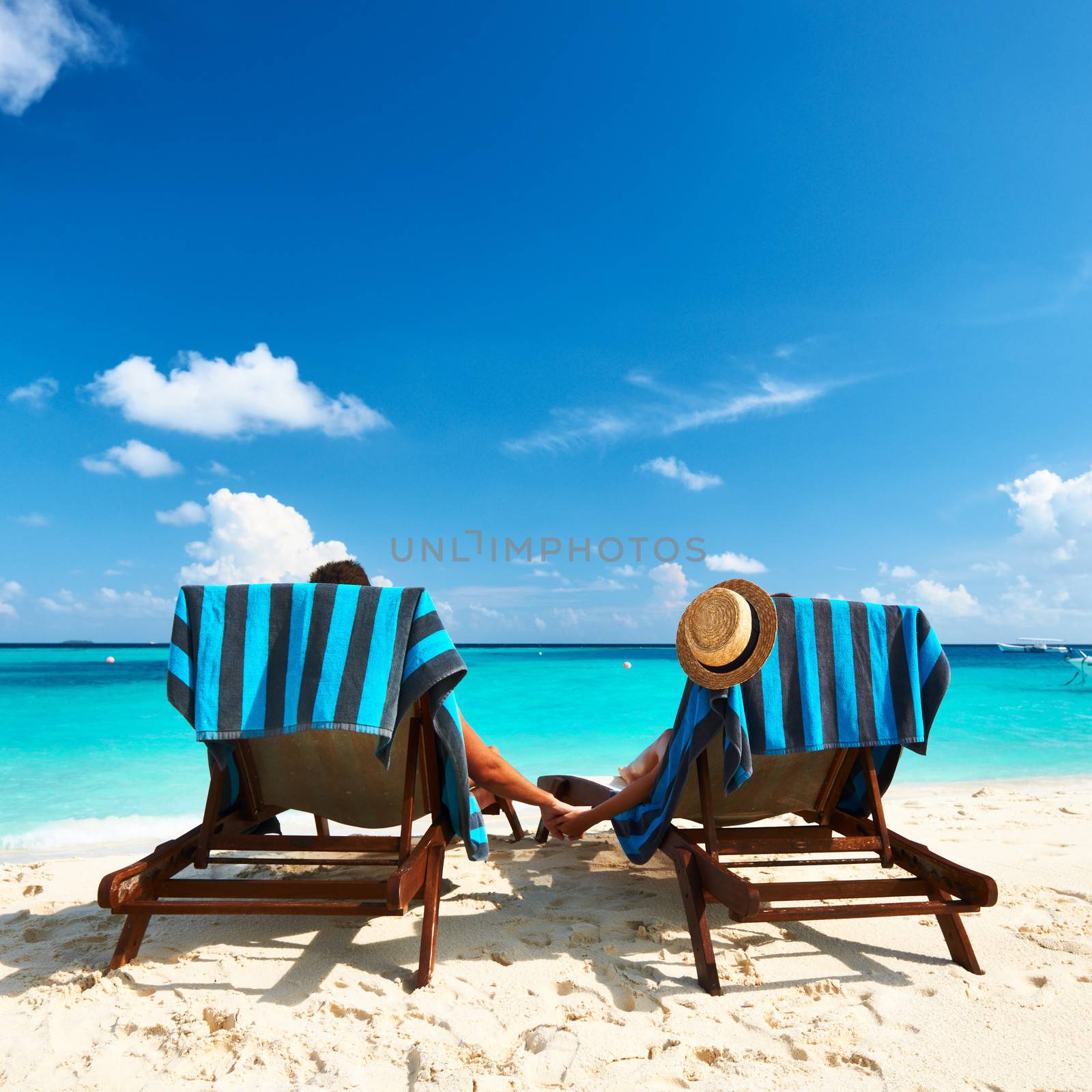 Couple on a tropical beach at Maldives