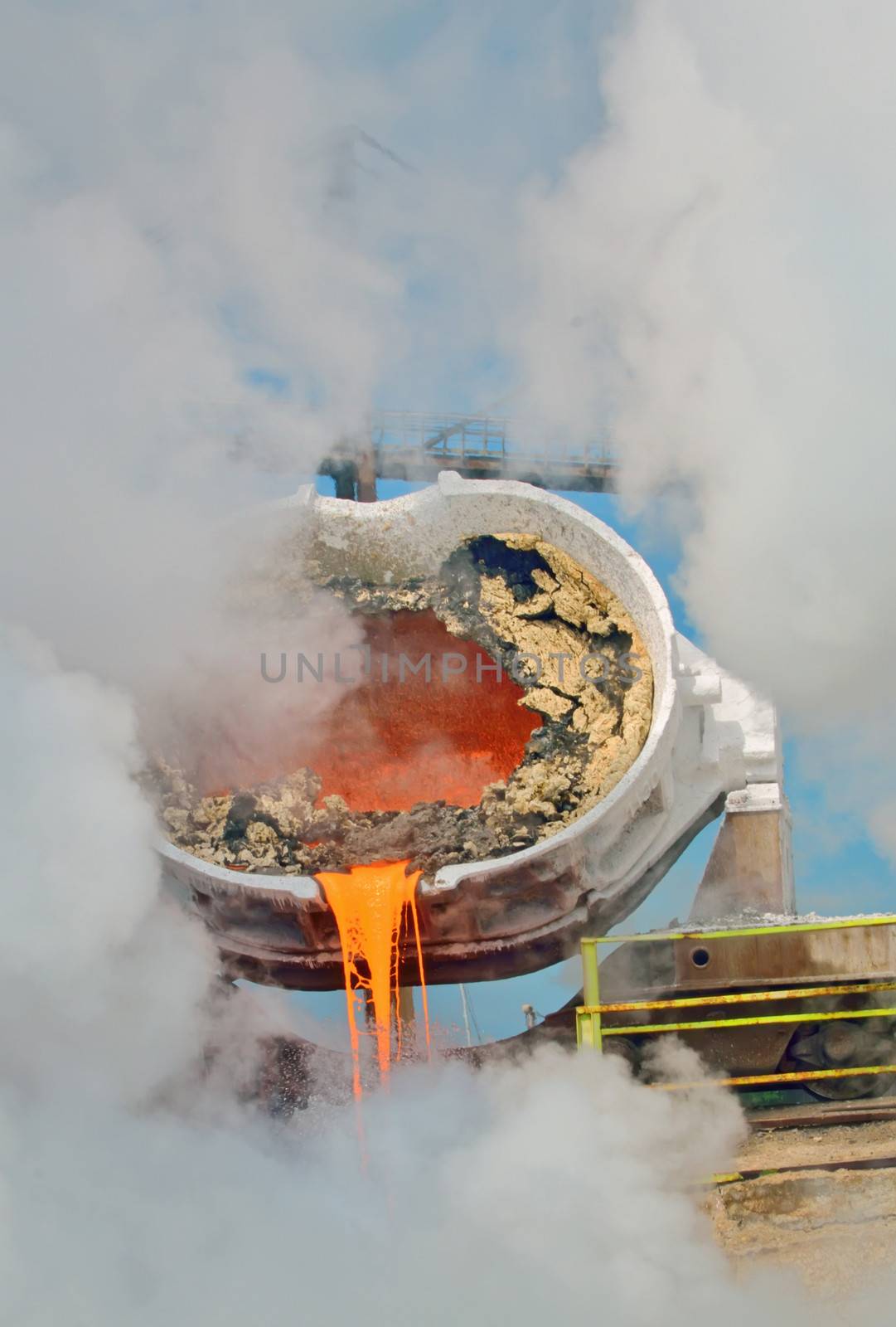 hot steel pouring in steel plant. Production of cast iron in steel mills