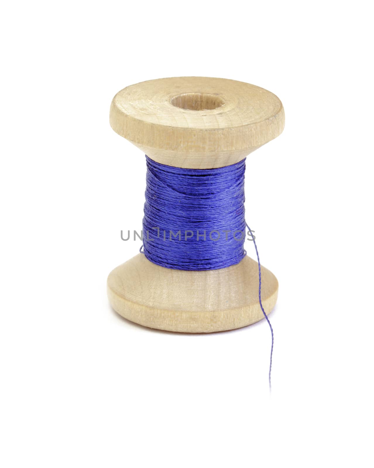 Spool of thread on white background