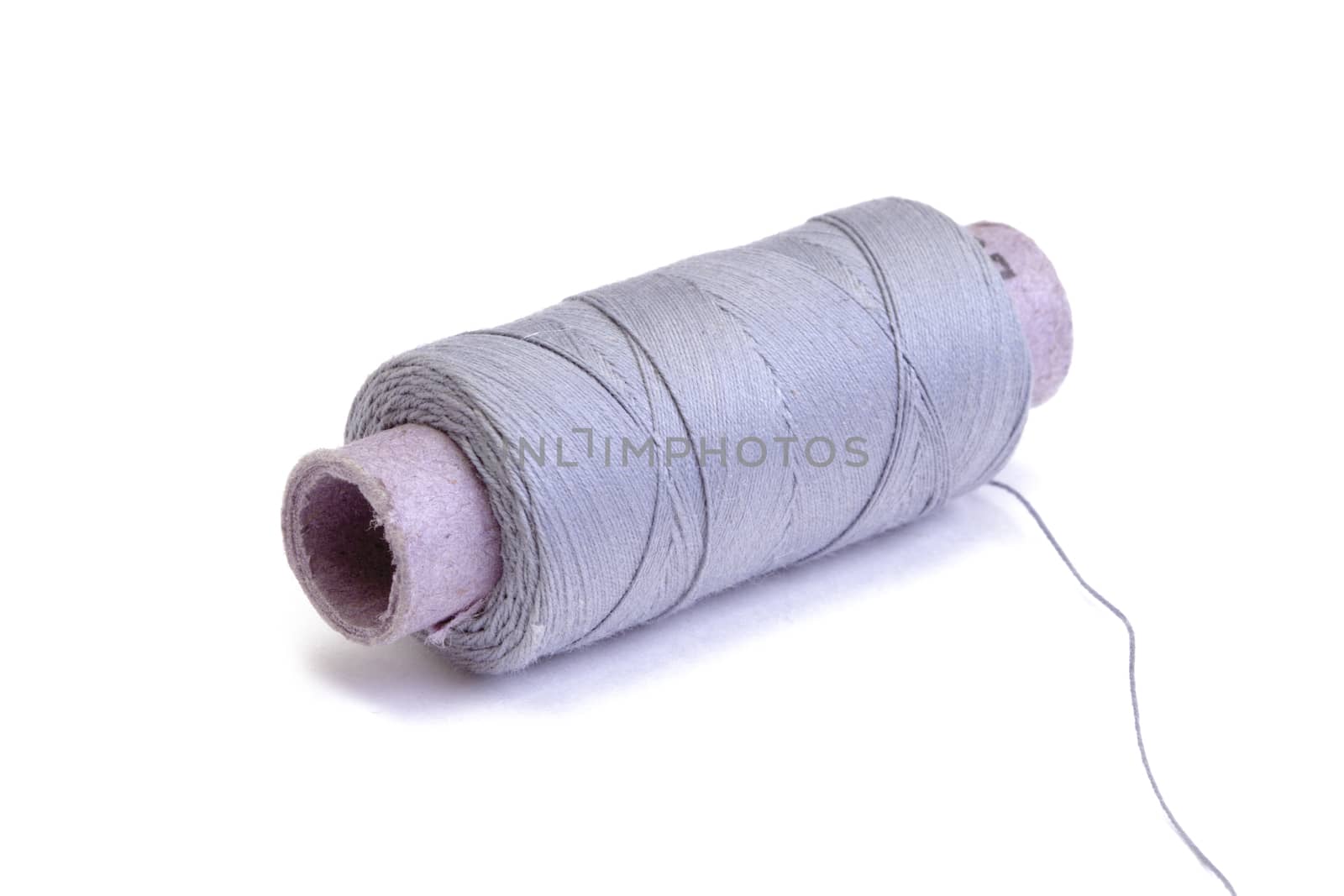 Spool of thread on white background