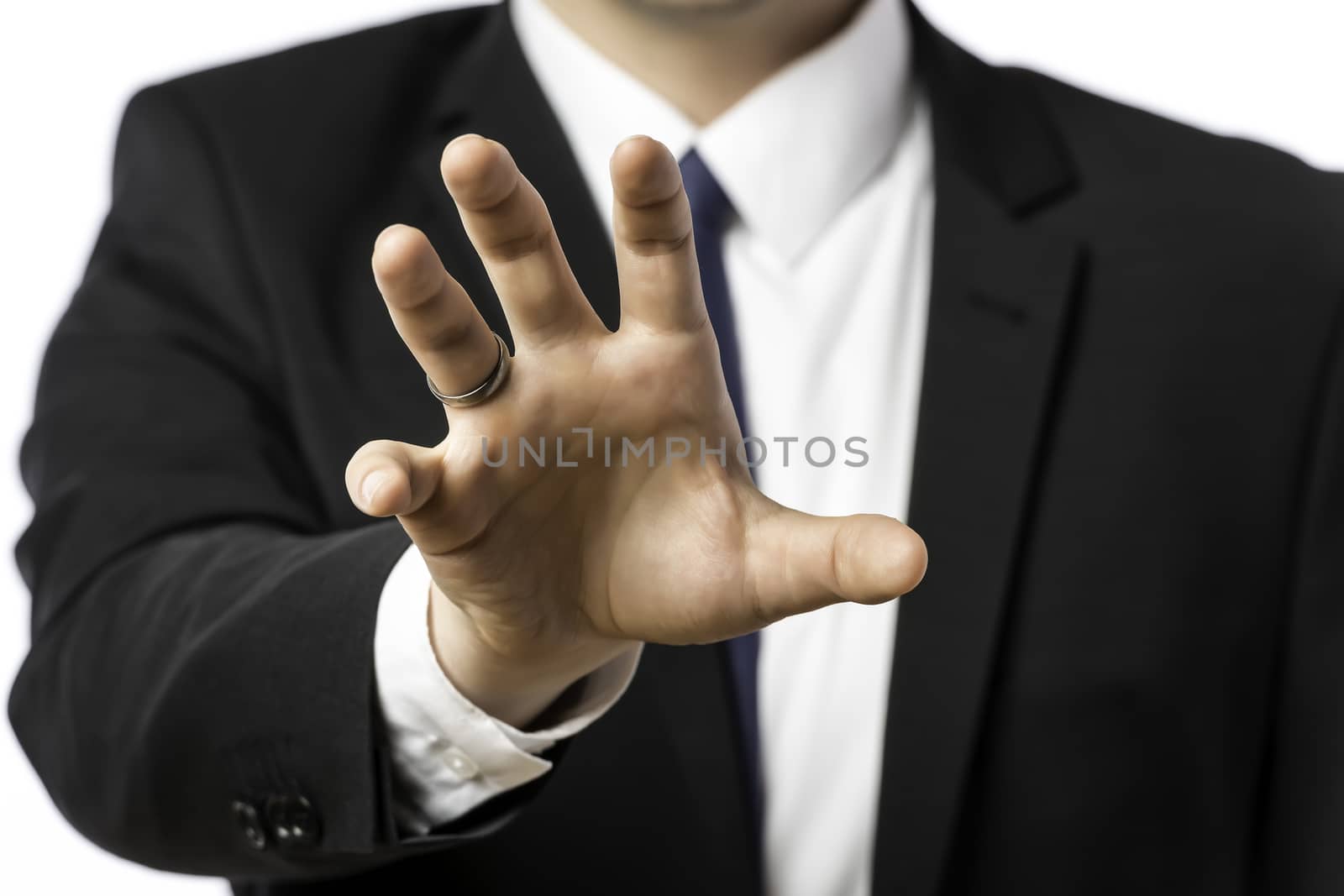 Businessman in a suit holds out his hand, isolated on white background