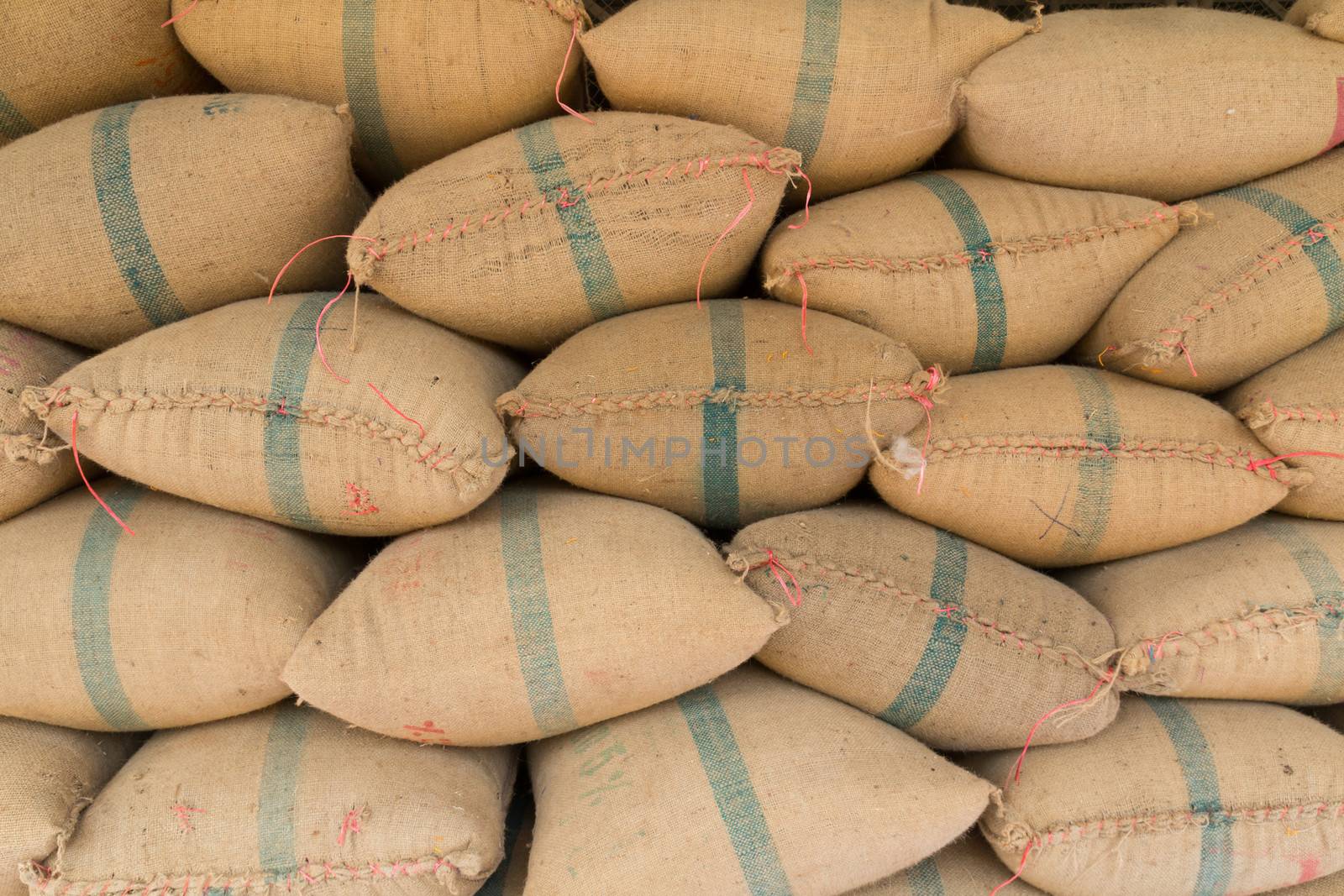 Old hemp sacks containing rice placed profoundly stacked  by lavoview