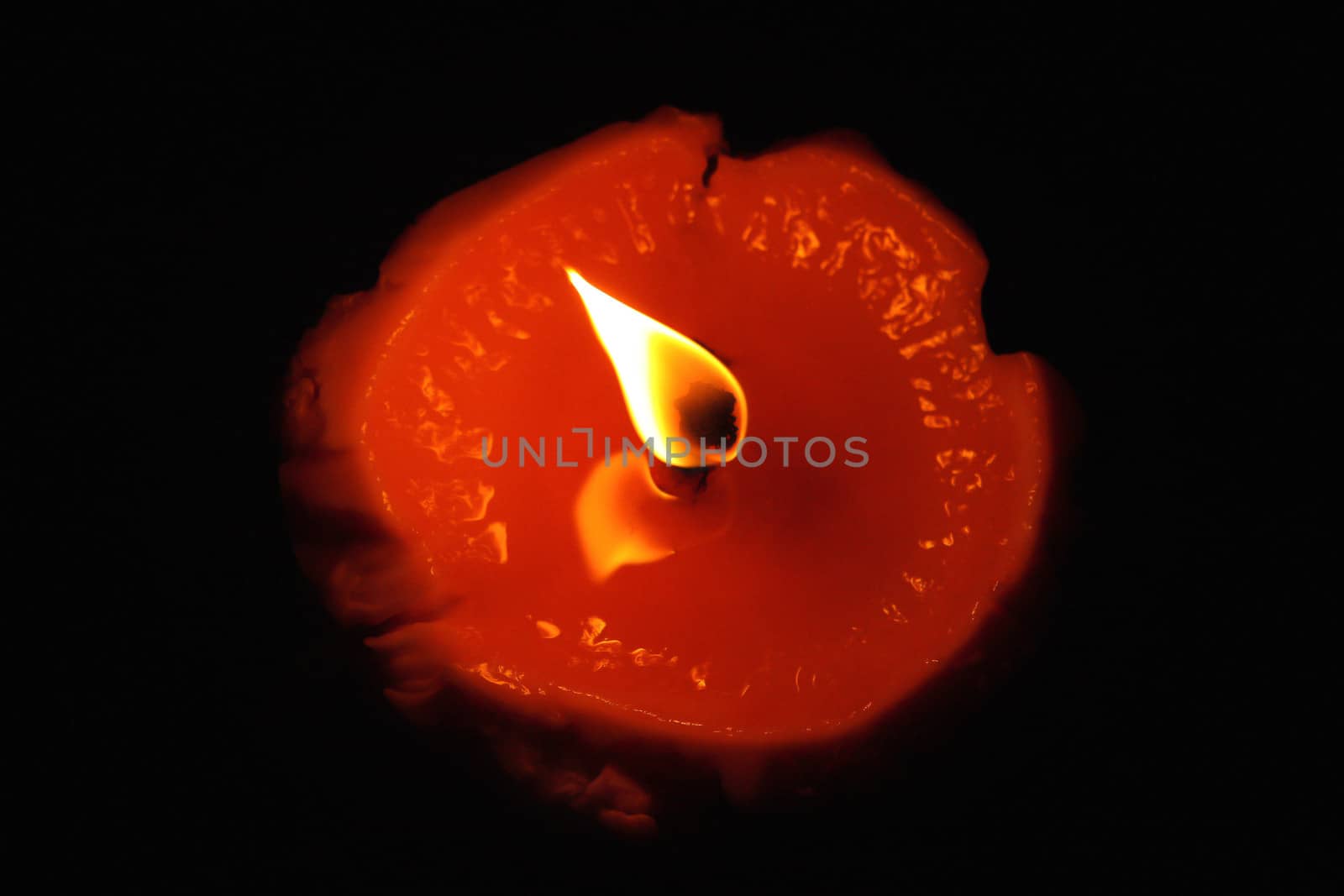 Red candle flame - top view by cococinema