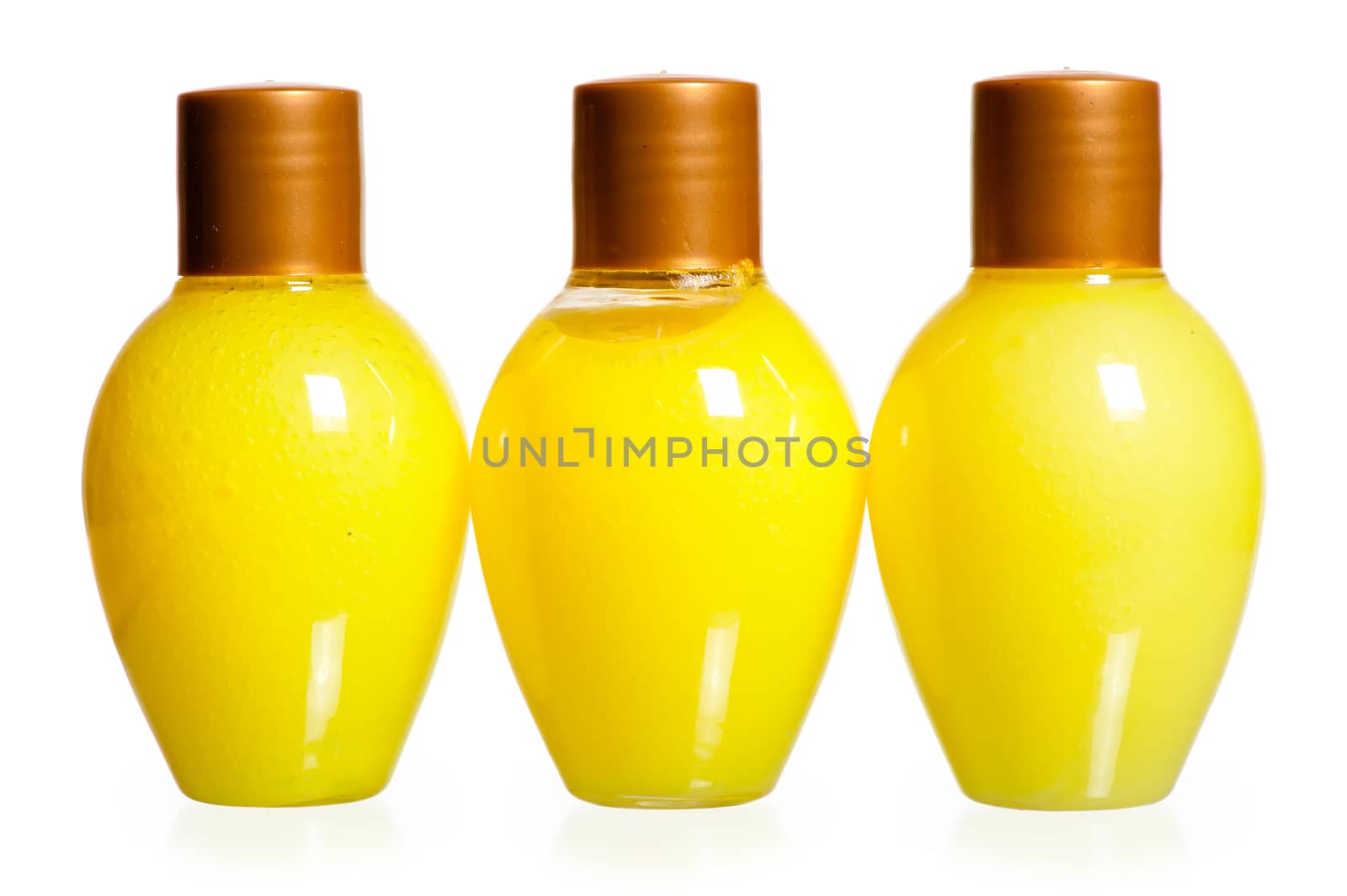 three yellow bottles of cosmetics by kosmsos111