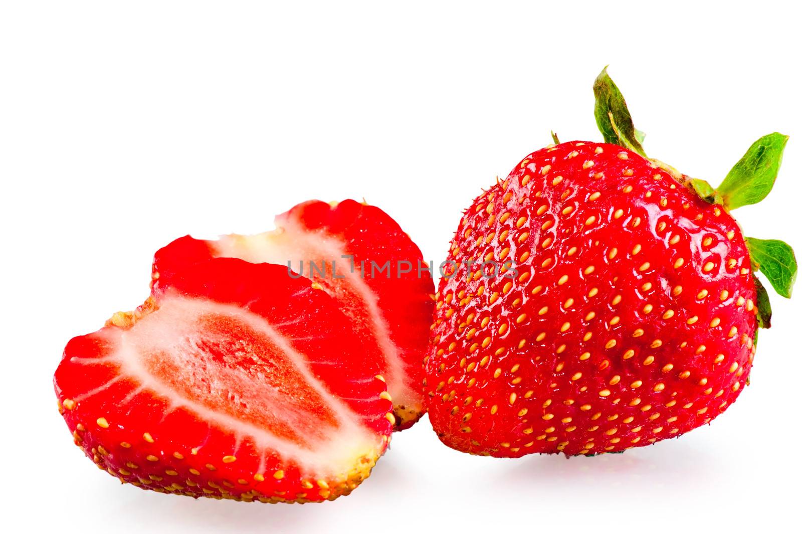 whole and sliced ������ripe strawberries on a white background