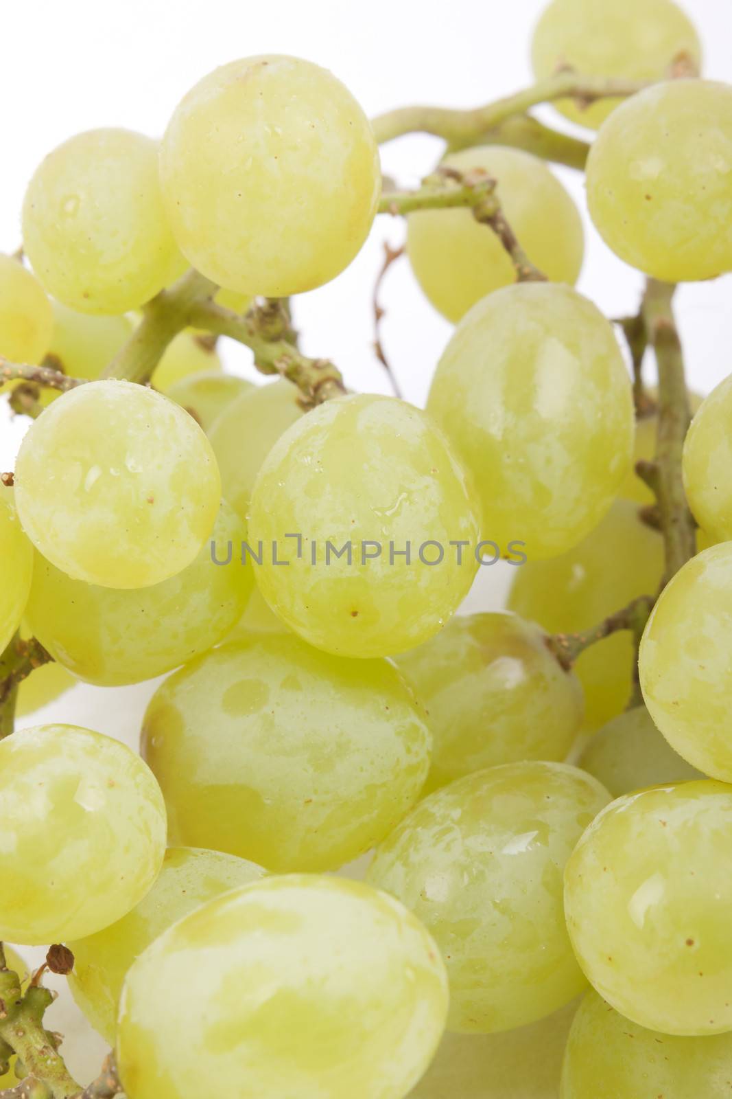 Cluster of green grapes isolated on a white background