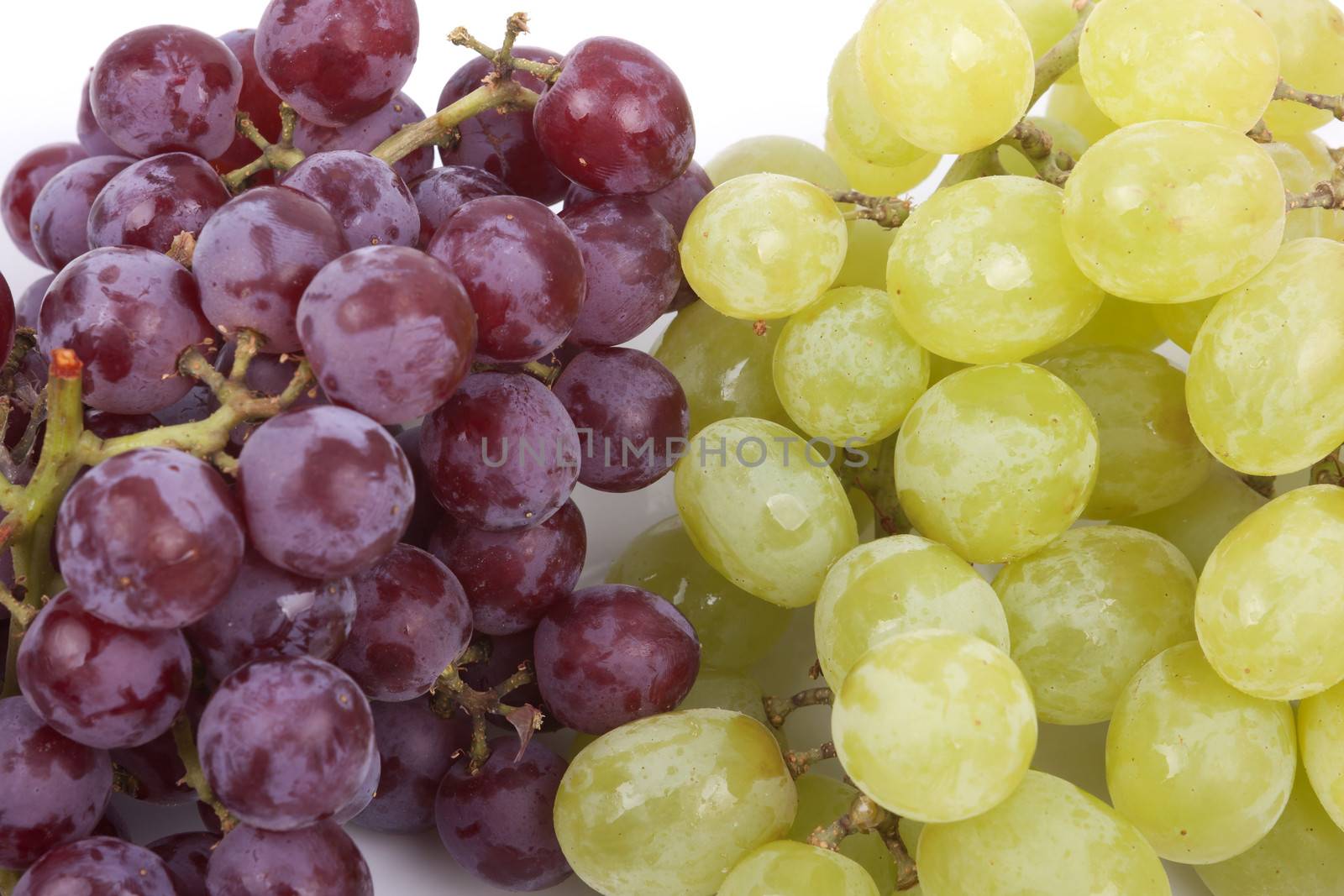 A bunch of green and red grapes isolated on a white background