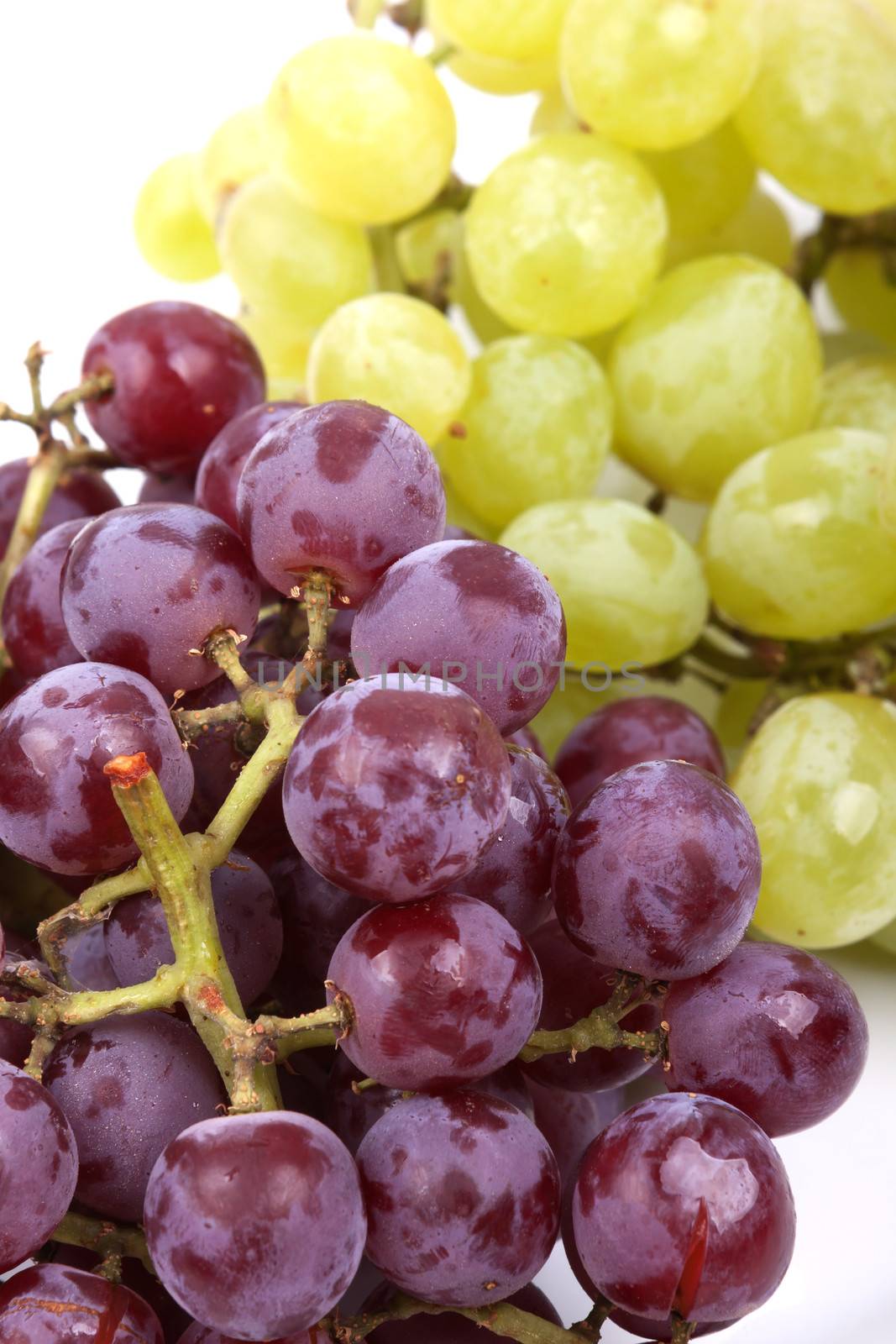 A bunch of green and red grapes isolated on a white background