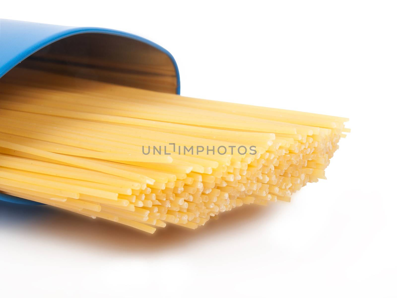 raw yellow spaghetti in blue case