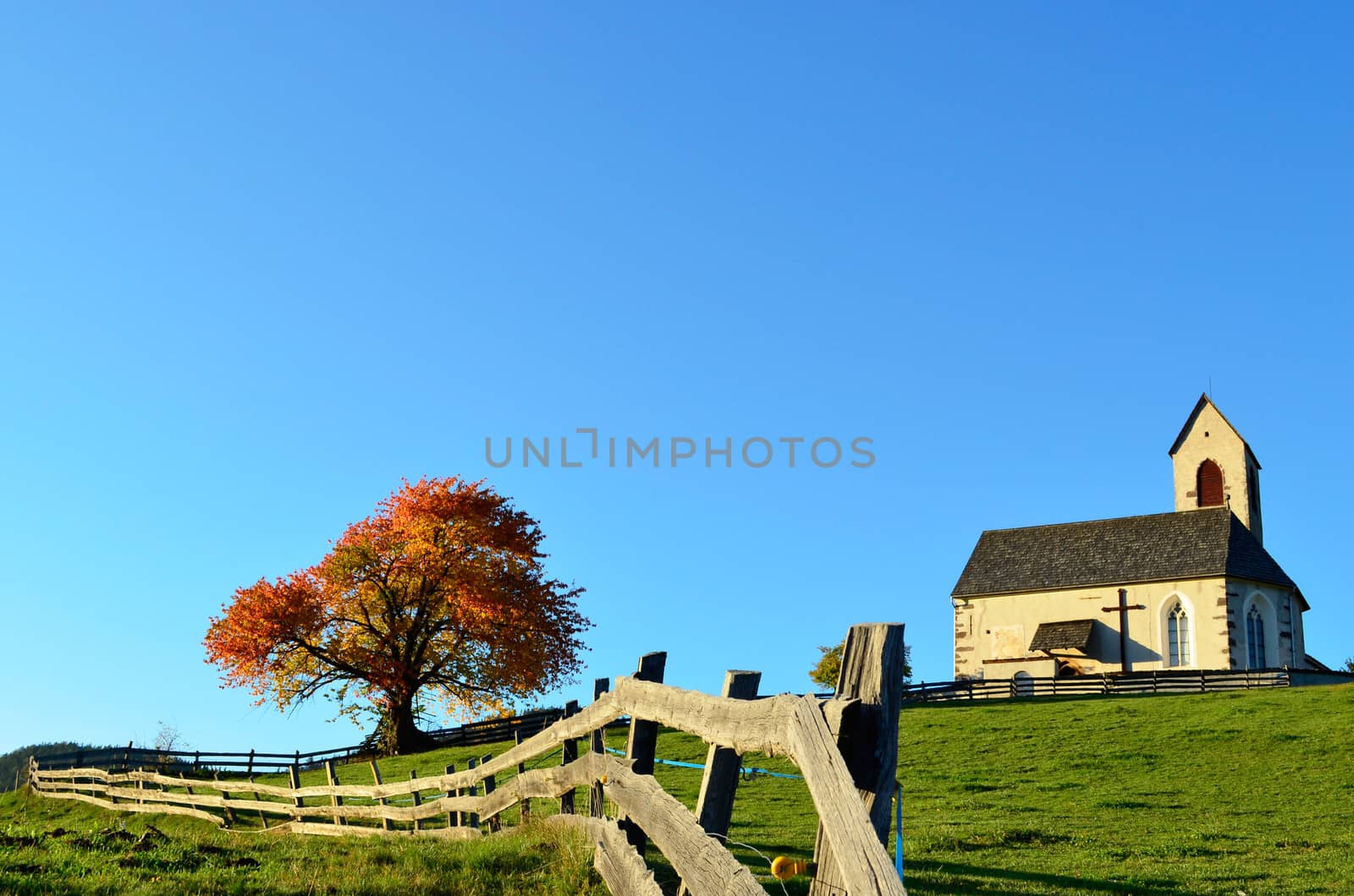 Church and fence in autumn by pljvv