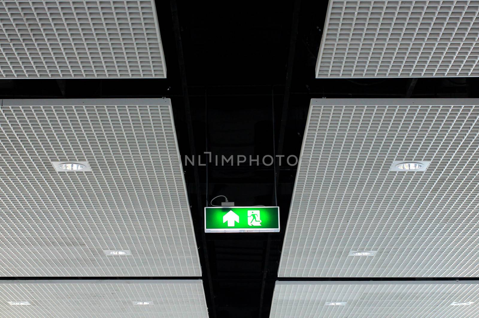 Fire exit sign on ceiling with light
