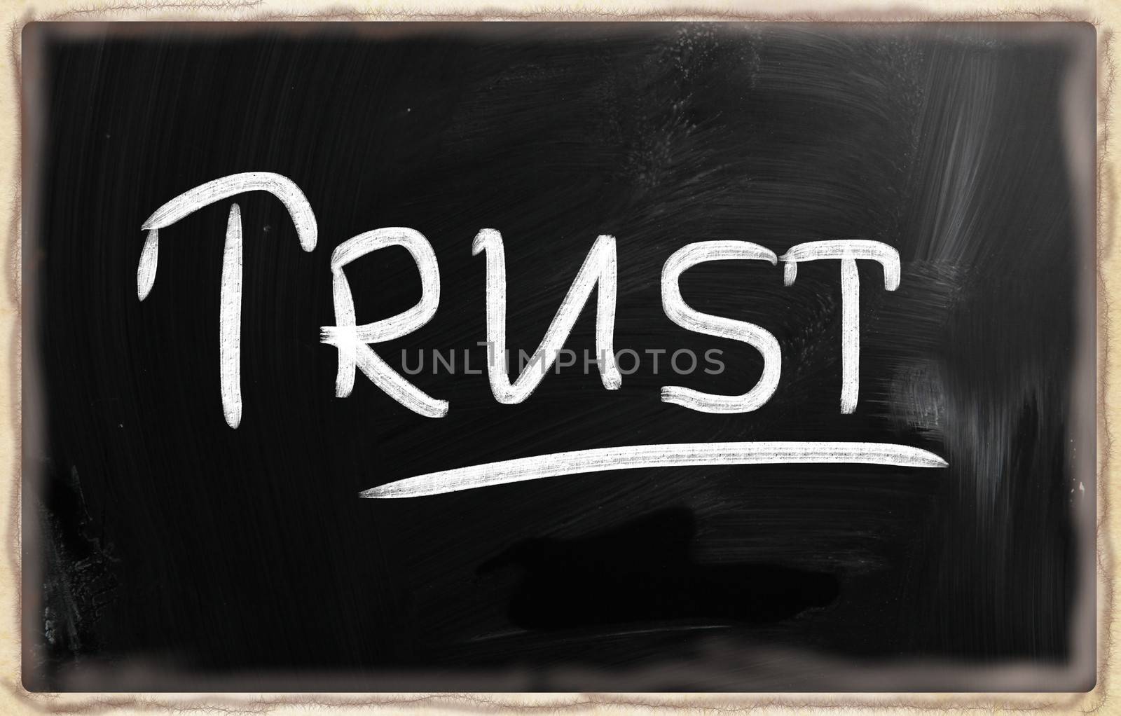 trust written with chalk on blackboard.