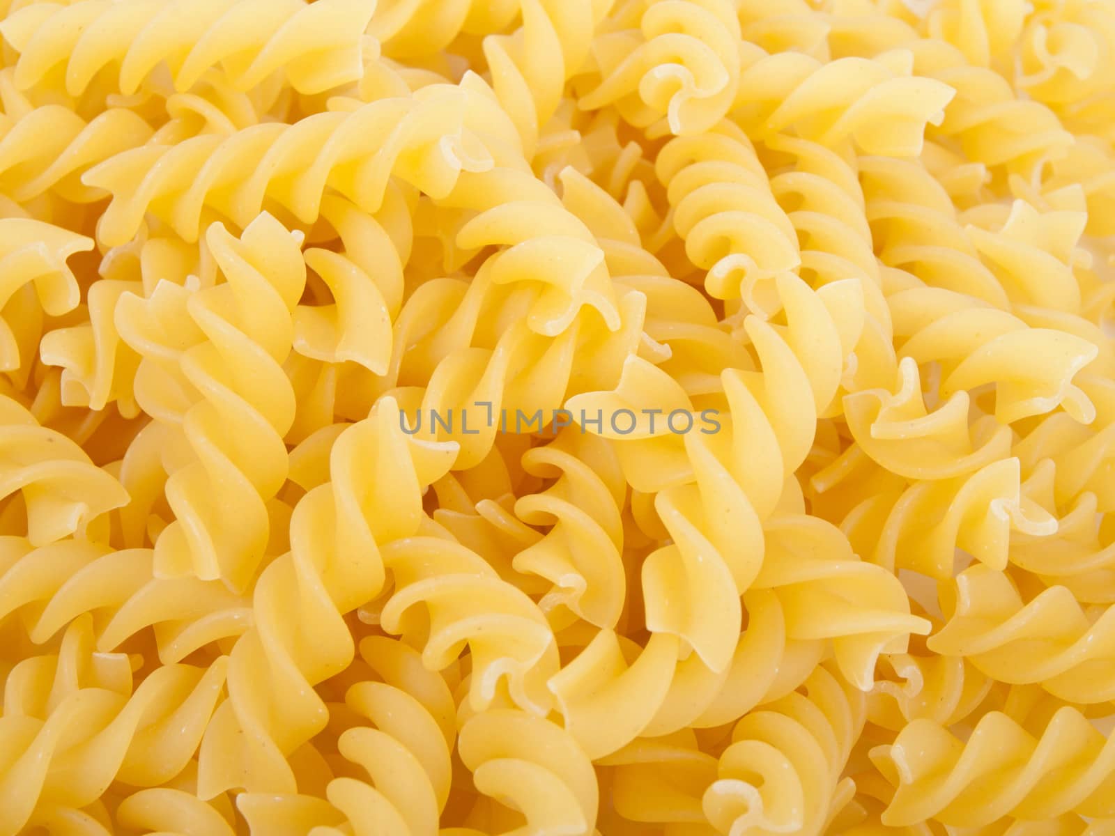 raw yellow fusilli - italian pasta