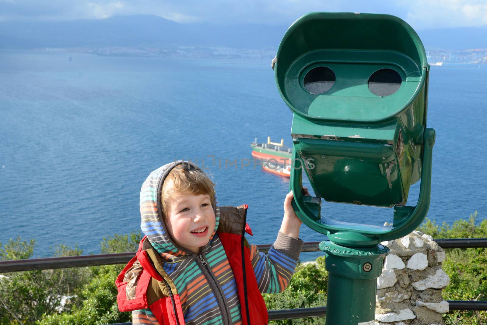 boy stands at the telescope in Gibraltar by finta2609