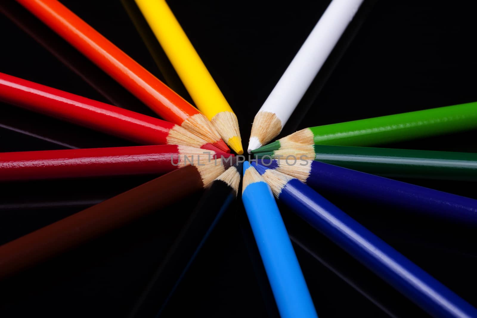 Color pencils isolated on black background