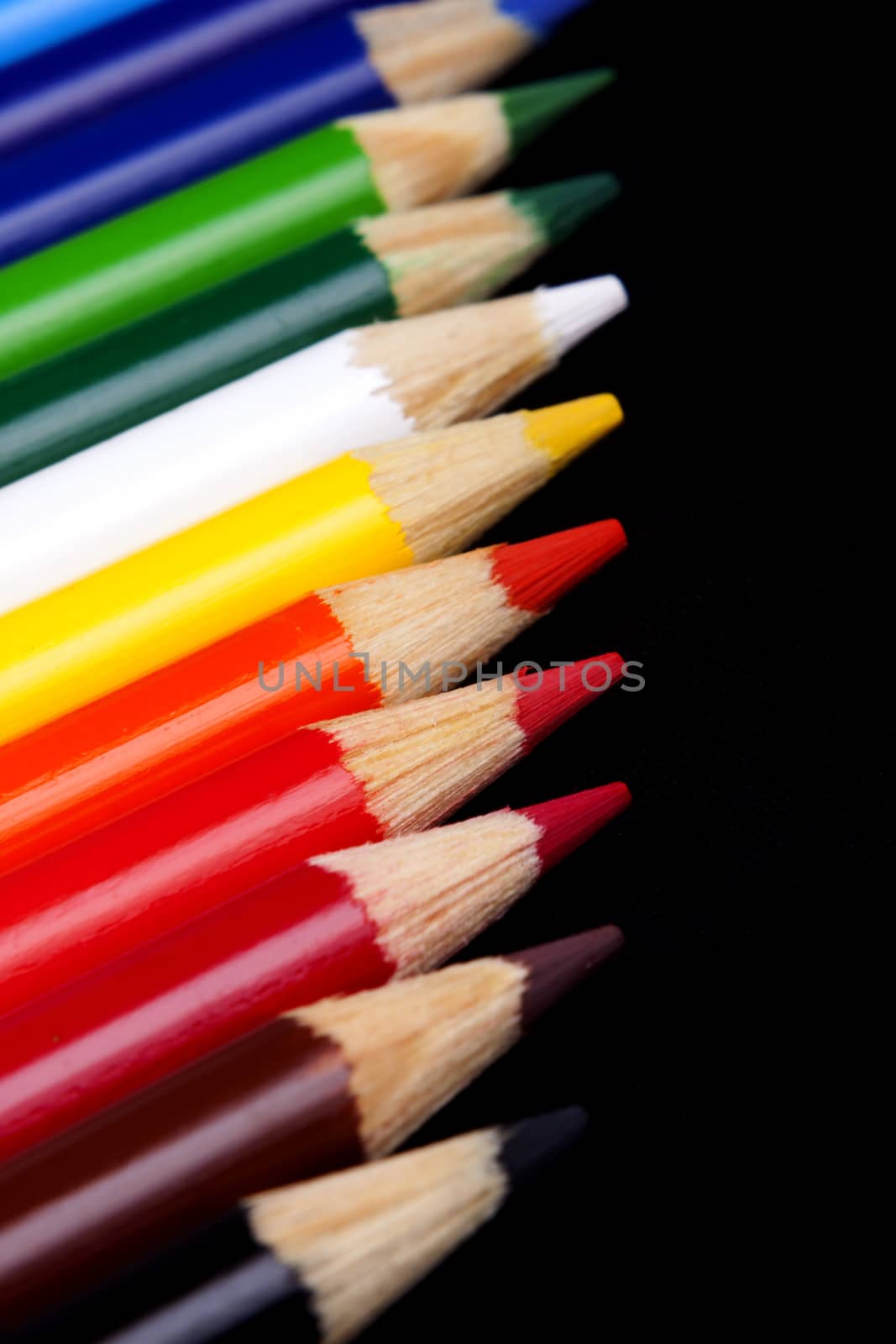 Color pencils isolated on black background