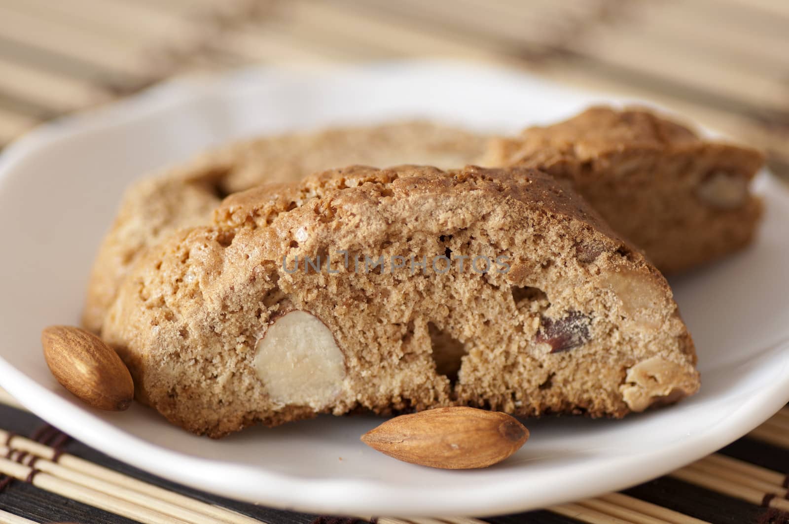 Delicious cantuccini cookies close up on saucer