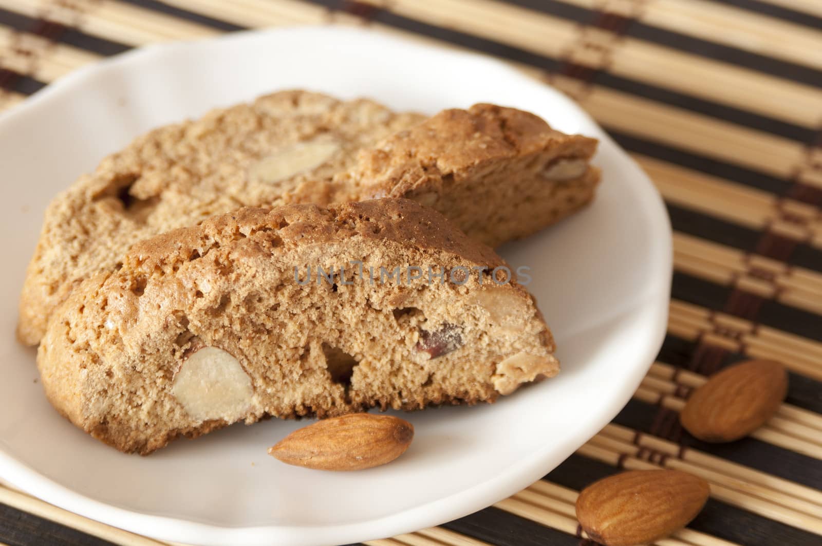 Delicious cantuccini cookies close up on saucer