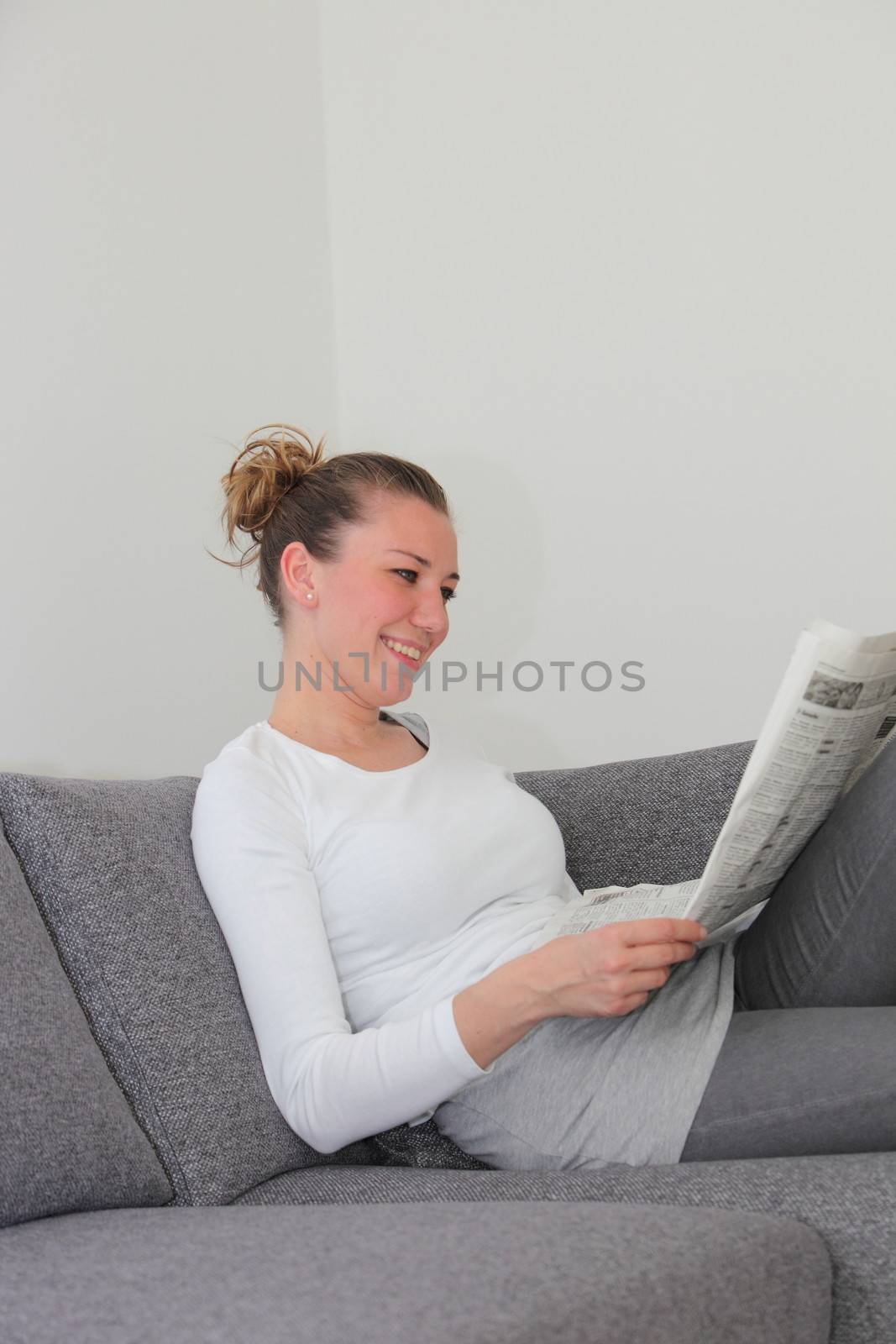 Woman enjoying her morning newspaper by Farina6000