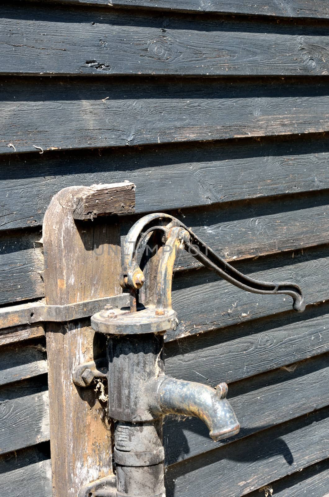 Vintage Water tap with wood background