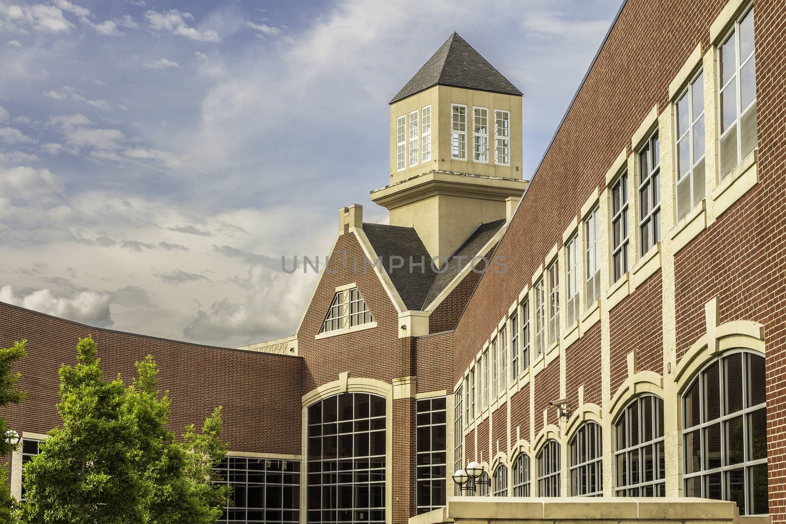 A view of a school entry set behind a bold blue sky.