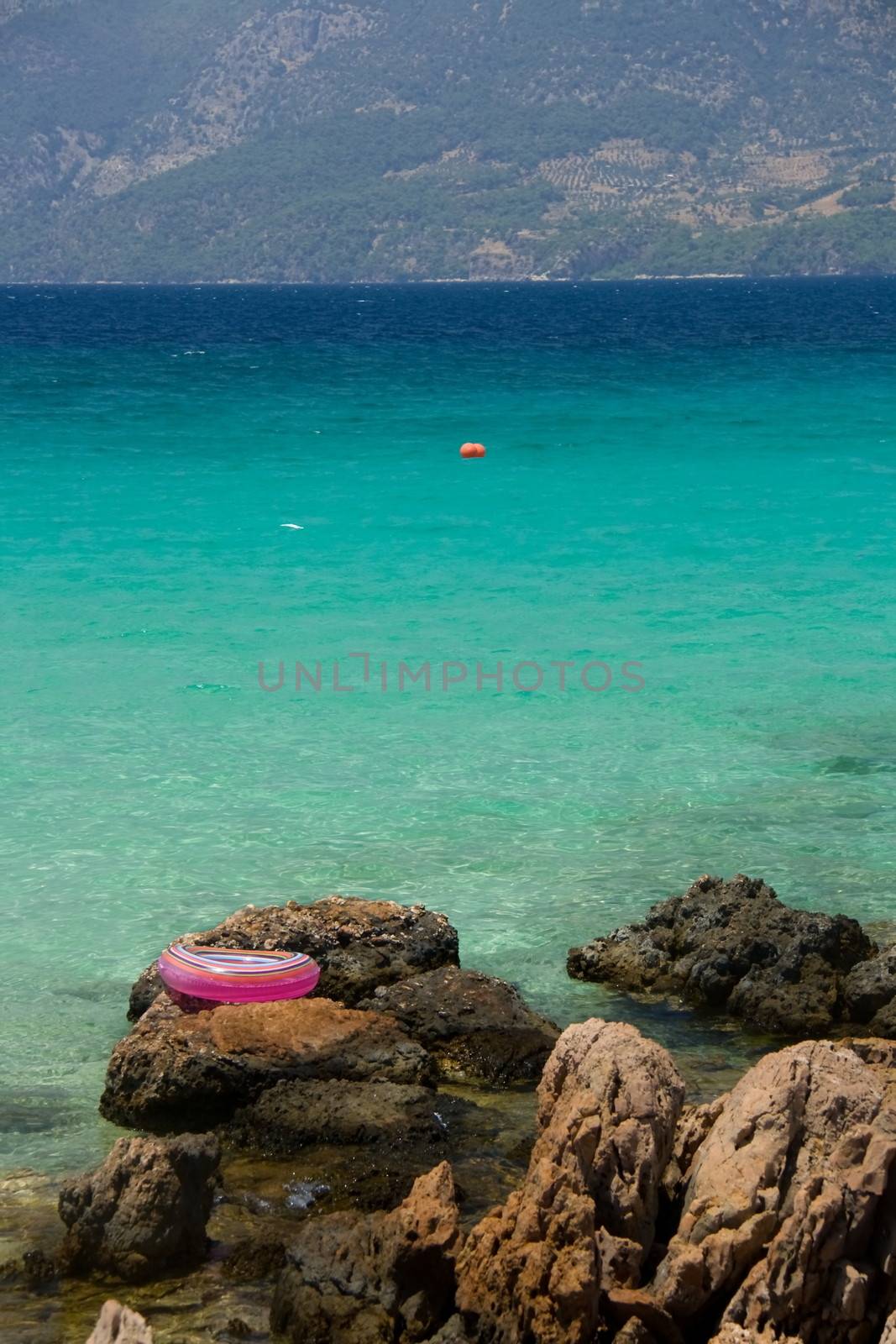 Buoy near turquose sea and consept of summer vacation