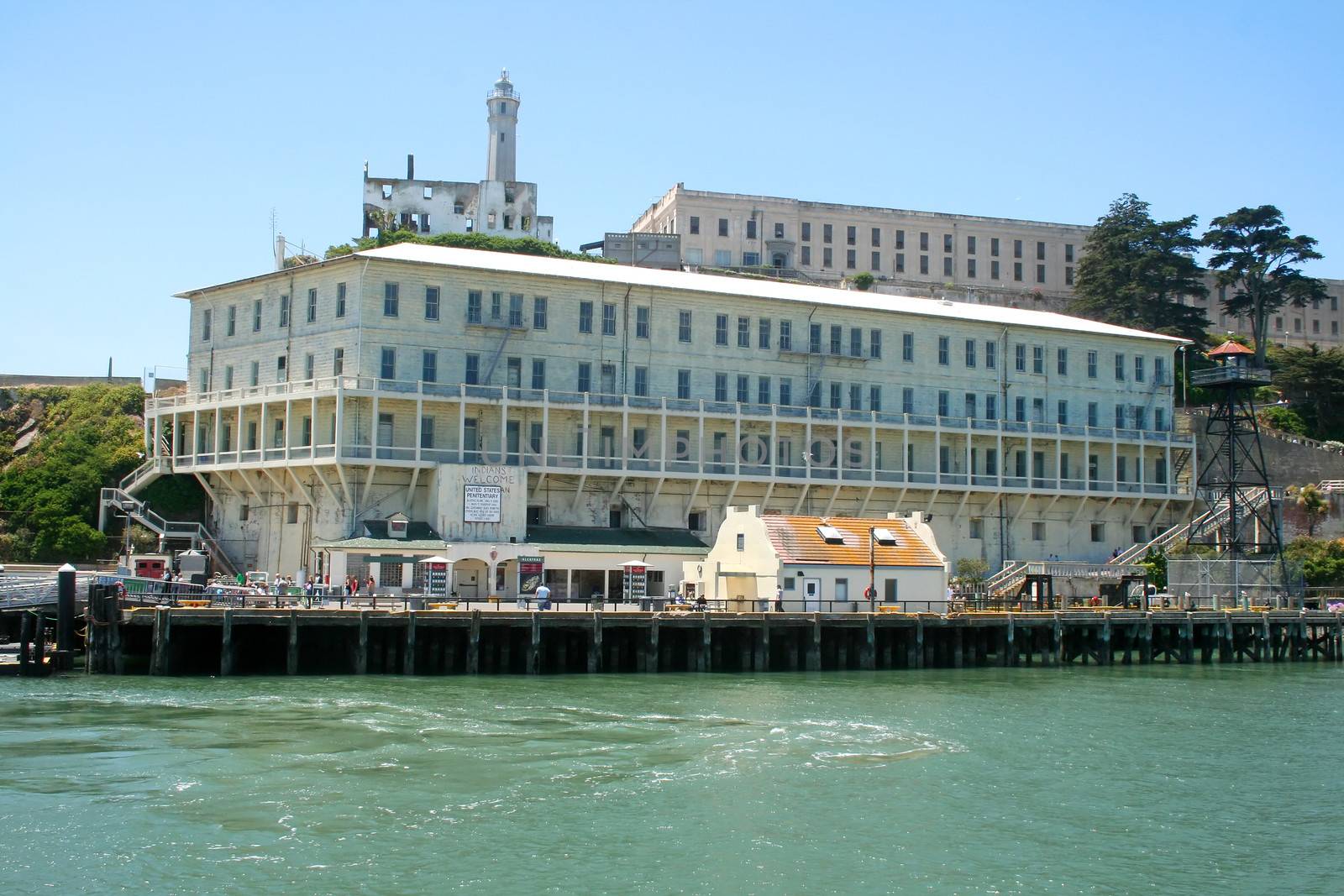 Building 64 residential apartments with the main cell block in the background on Alcatraz Island San Francisco.