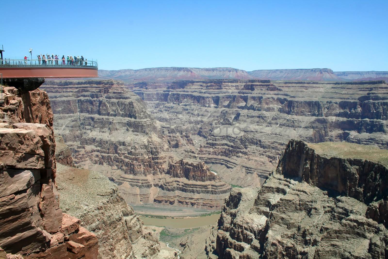 The glass skywalk observation bridge suspended four thousand feet above the Colorado River on the edge of the Grand Canyon West.