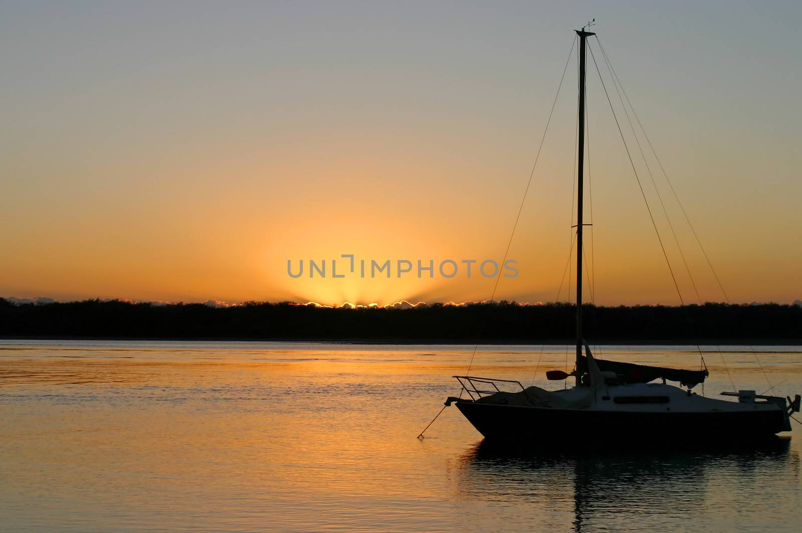 Yacht moored at peace in the early morning dawn light.