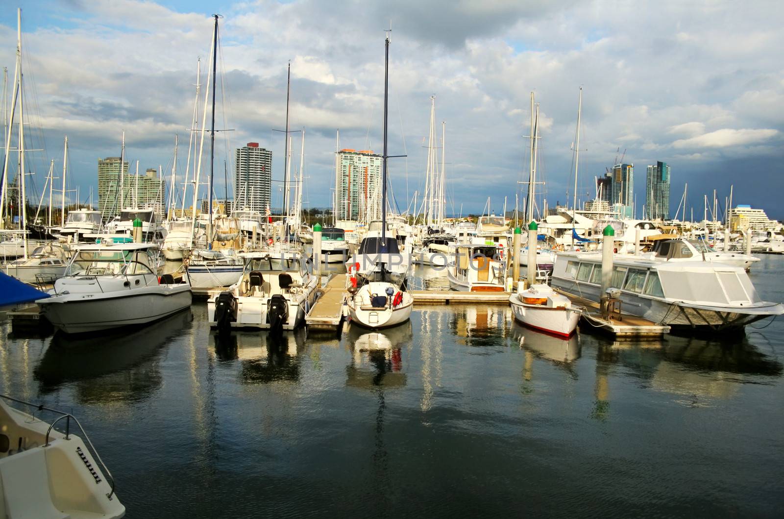 Marina Boats Against Towers by jabiru