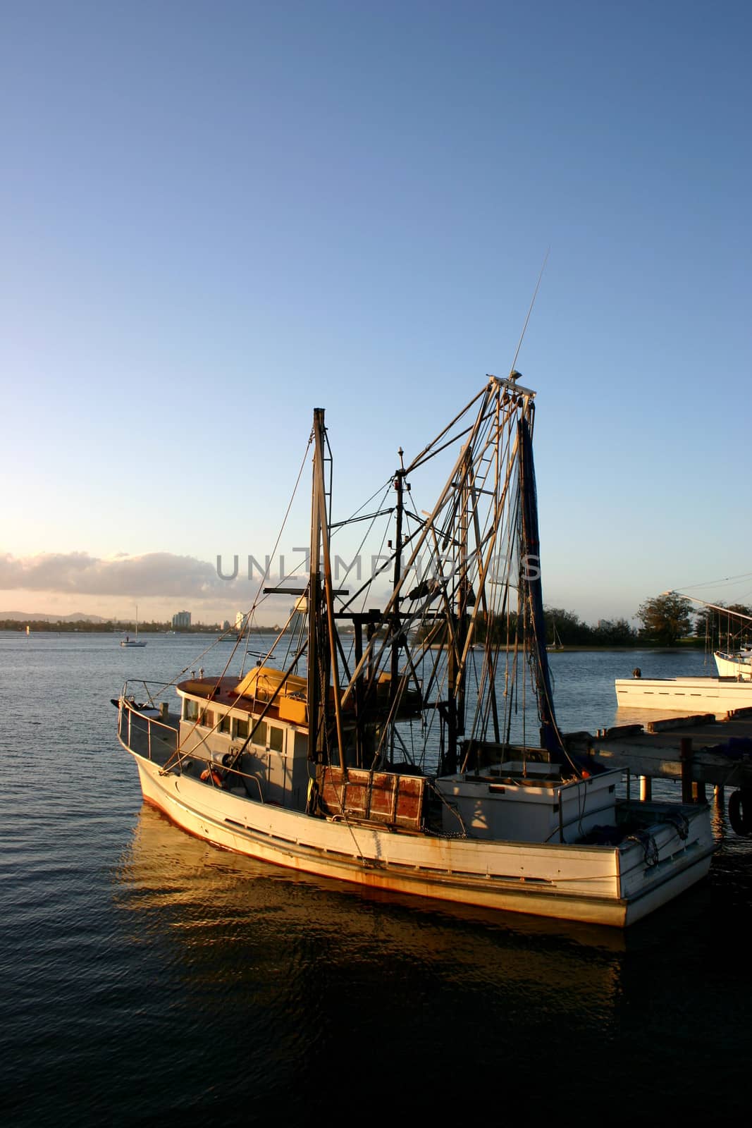 Fishing and prawn trawler at dock in the late afternoon light.