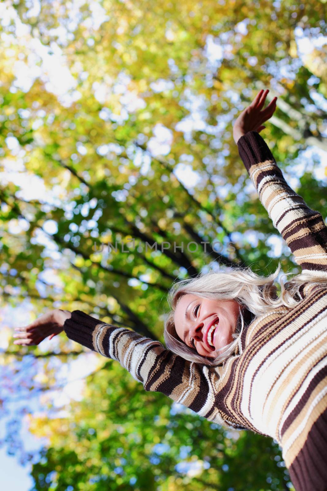 autumn woman hands in the air