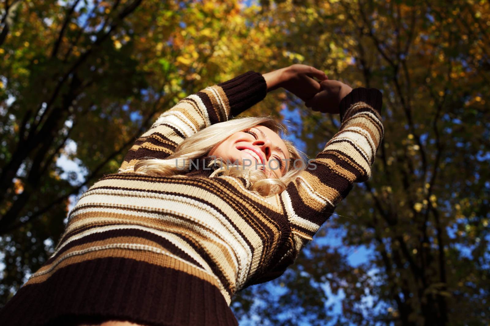 autumn woman hands in the air